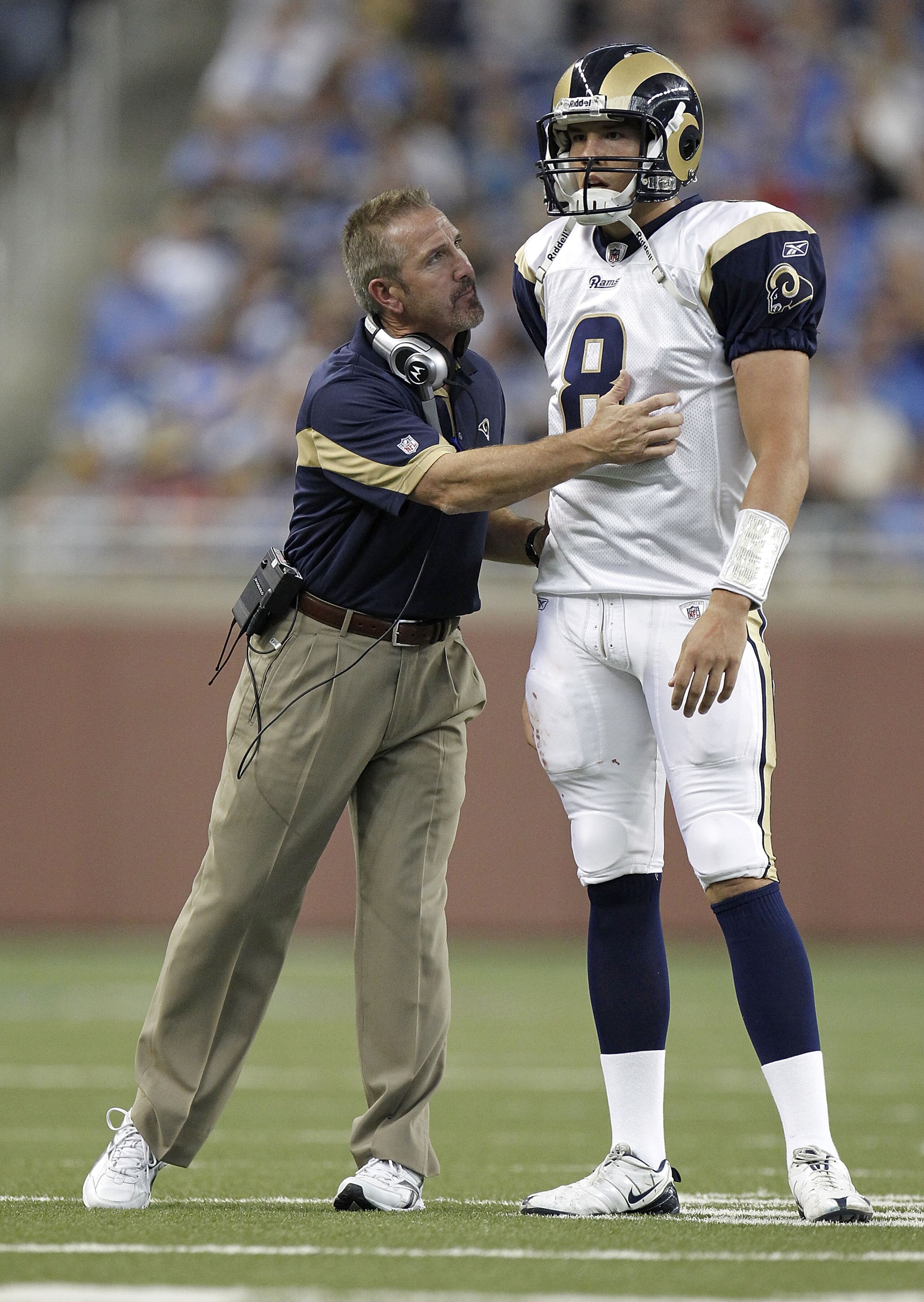 DETROIT - OCTOBER 10: Sam Bradford #8 of the St. Louis Rams talks with head coach Steve Spagnuolo while playing the Detroit Lions on October 10, 2010 at Ford Field in Detroit, Michigan.  (Photo by Gregory Shamus/Getty Images)