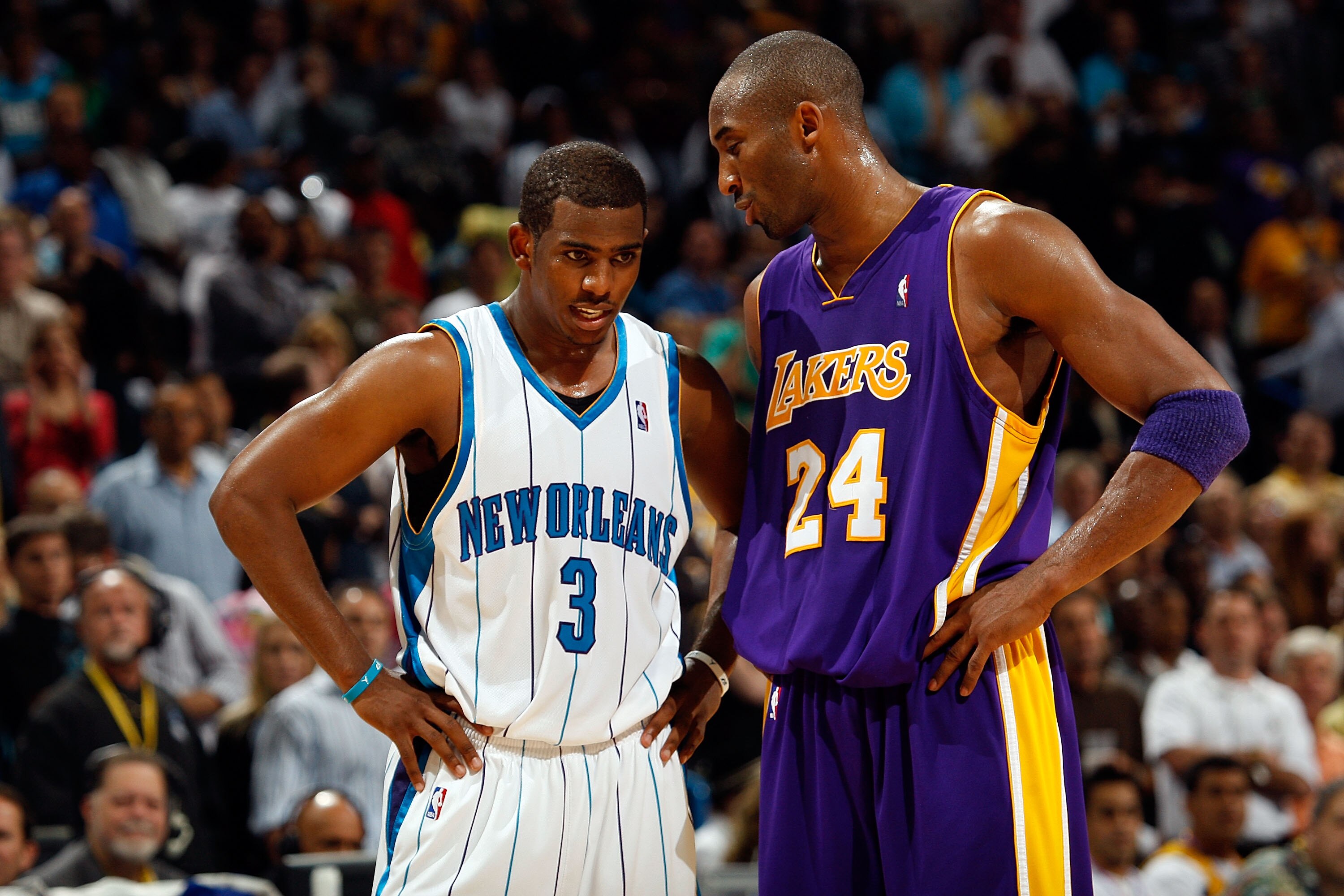 NEW ORLEANS - NOVEMBER 12:  Chris Paul #3 of the New Orleans Hornets talks with Kobe Bryant #24 of the Los Angeles Lakers  at the New Orleans Arena on November 12, 2008 in New Orleans, Louisiana. The Lakers defeated the Hornets 93-86.  NOTE TO USER: User