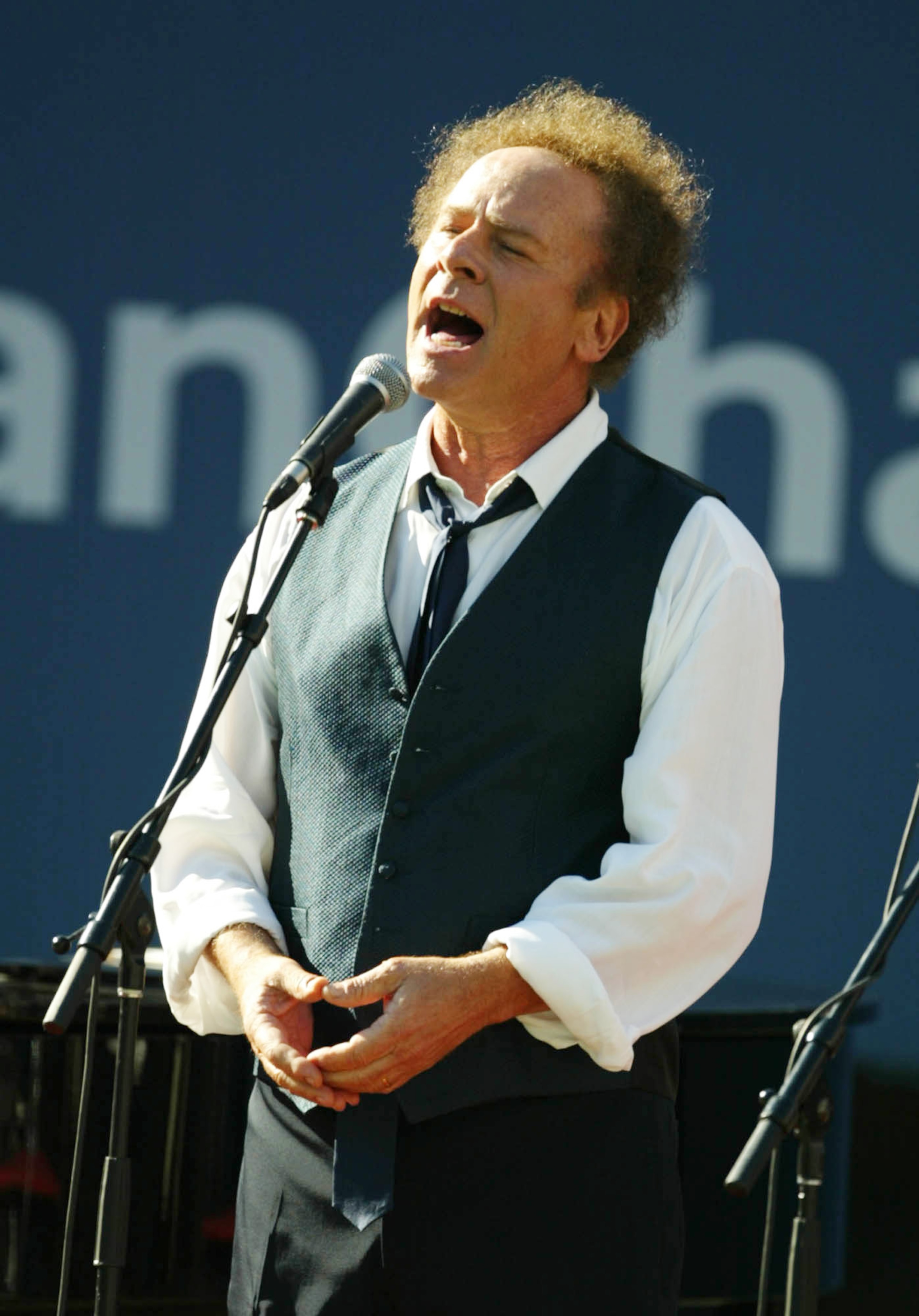 FLUSHING, NY - SEPTEMBER 8: Art Garfunkel performs before Pete Sampras and Andre Agassi take the court during the finals of the US Open September 8, 2002 at the USTA National Tennis Center in Flushing Meadows Corona Park in Flushing, New York. (Photo by FLUSHING, NY - SEPTEMBER 8: Art Garfunkel performs before Pete Sampras and Andre Agassi take the court during the finals of the US Open September 8, 2002 at the USTA National Tennis Center in Flushing Meadows Corona Park in Flushing, New York. (Photo by