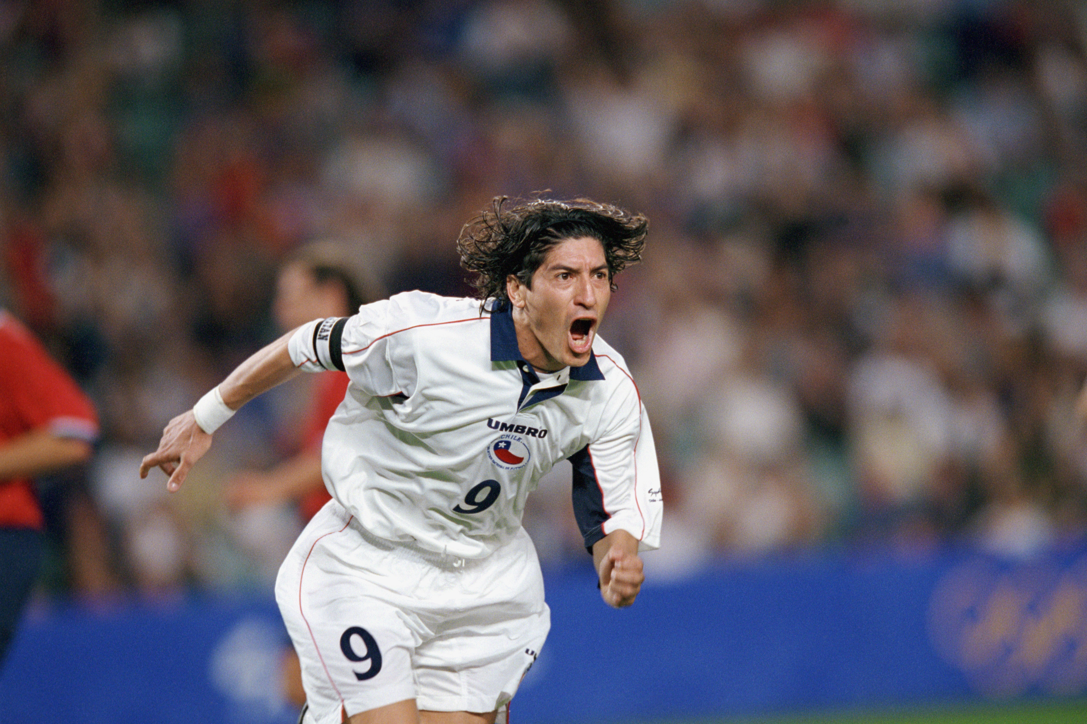 SYDNEY, AUSTRALIA - SEPTEMBER 29:  Ivan Zamorano #9 of Chile celebrates one of his two goals during the Olympic Men's Soccer Bronze Medal Game against the United States at Sydney Football Stadium in Sydney, Australia on September 29, 2000.  Chile won 2-0.