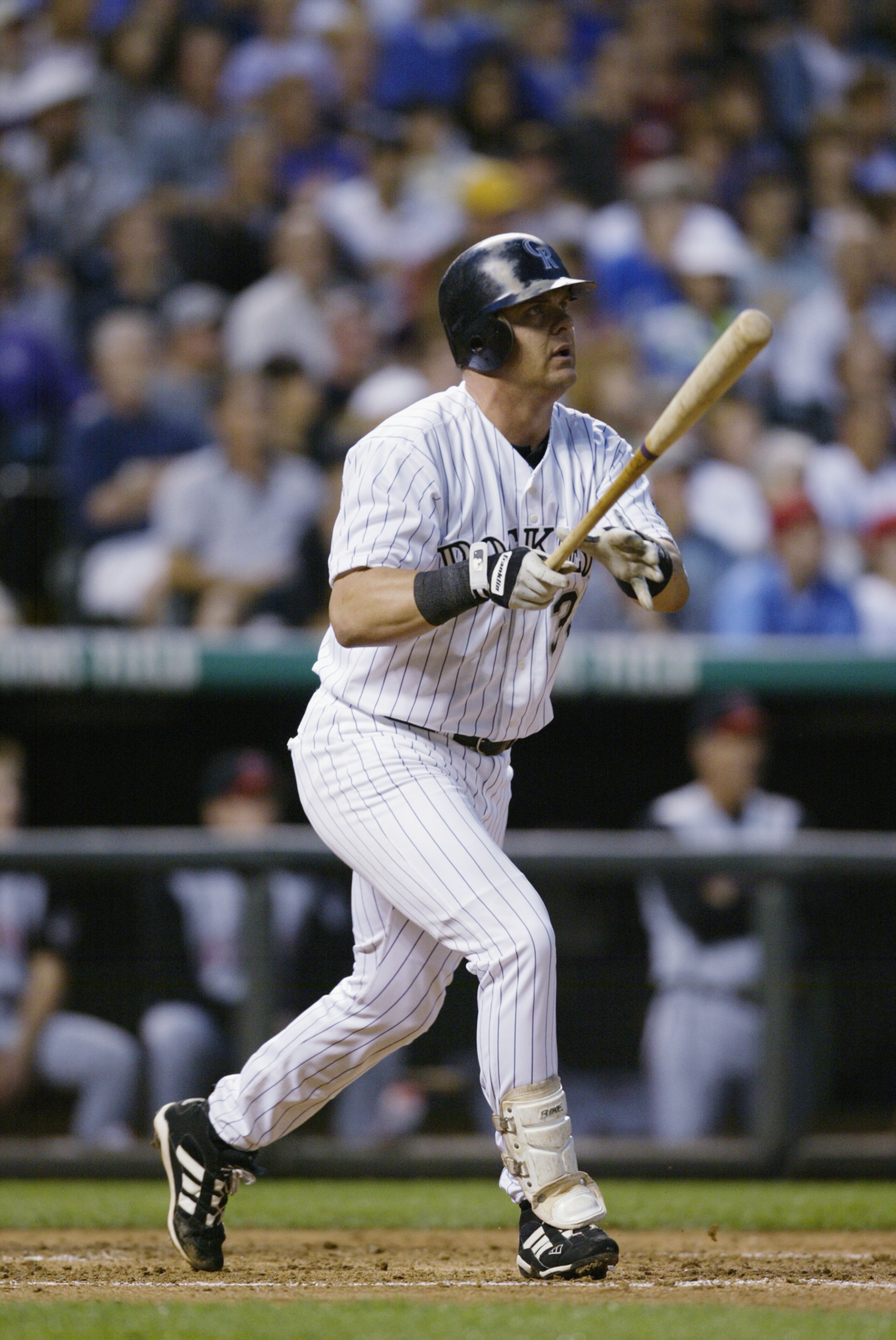 DENVER - AUG 07:   Larry Walker #33 of the Colorado Rockies watches his hit fly for a three-run home run against the Cincinnati Reds in the fourth inning at Coors Field in Denver August 4. (Photo by Brian Bahr/Getty Images)