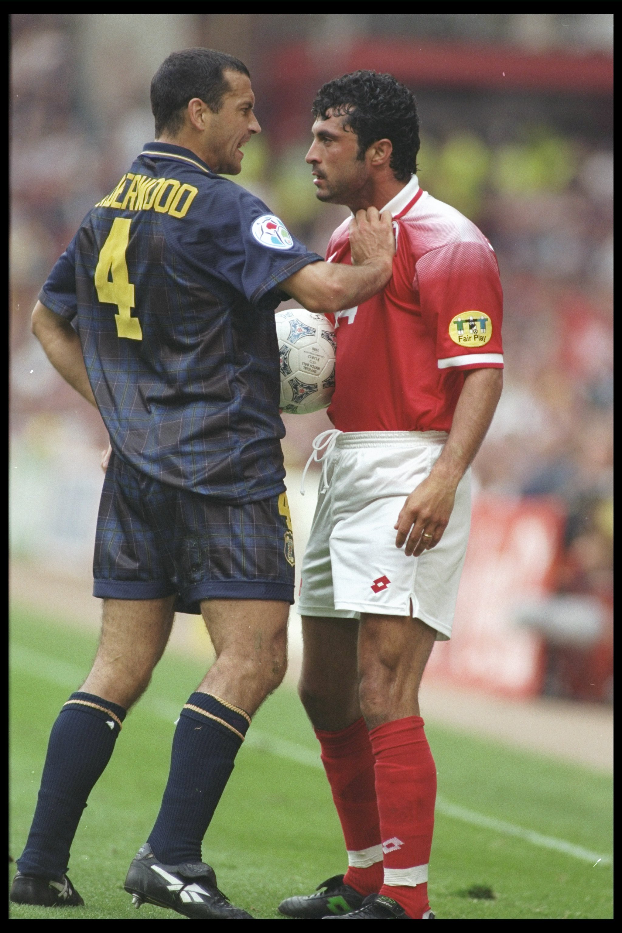 18 Jun 1996:  Colin Calderwood of Scotland argues with Kubilay Turkyilmaz of Switzerland during the Group A match at Villa Park in the European Football Championships. Scotland beat Switzerland 1-0.