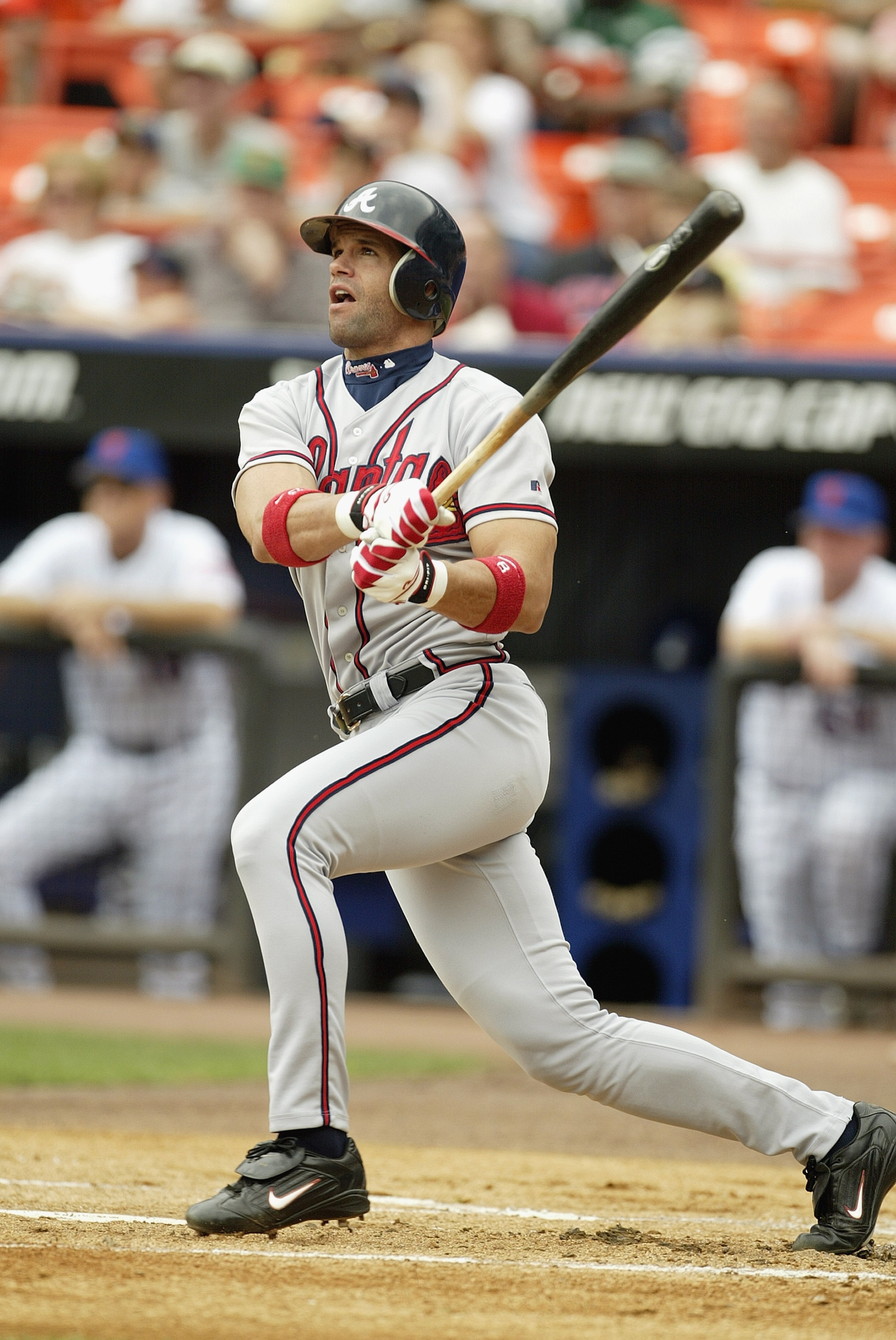 FLUSHING, NY - JULY 9:  Javy Lopez #8 of the Atlanta Braves watches the ball take flight against the New York Mets on July 9, 2003 at Shea Stadium in Flushing, New York.  The Braves won 6-3.  (Photo by Al Bello/Getty Images)