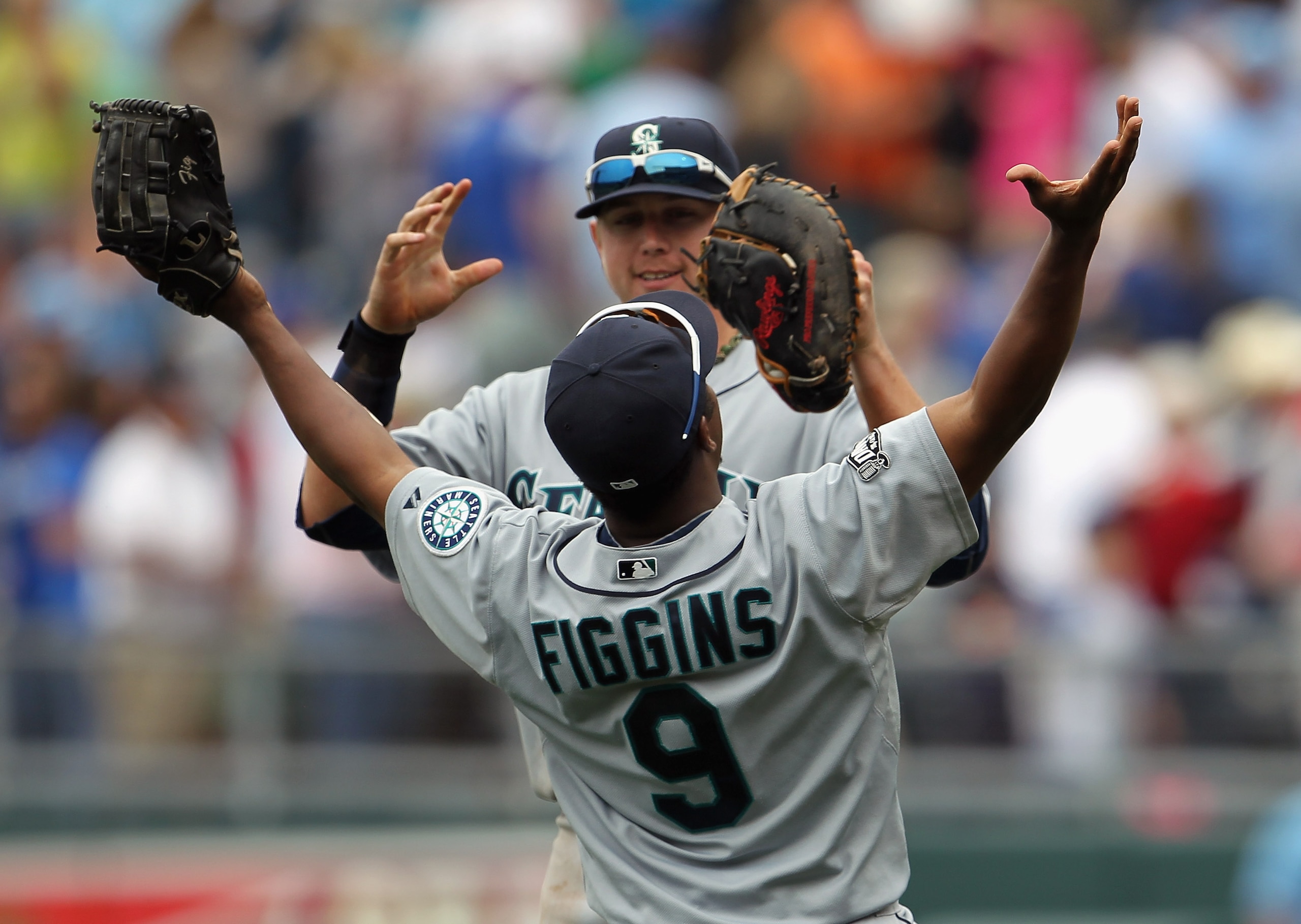KANSAS CITY, MO - APRIL 17: #17 and Chone Figgins #9 of the Seattle Mariners celebrate after the Mariners defeated the Kansas City Royals 3-2 to win the game on April 17, 2011 at Kauffman Stadium in Kansas City, Missouri. (Photo by Jamie Squire/Getty I KANSAS CITY, MO - APRIL 17: #17 and Chone Figgins #9 of the Seattle Mariners celebrate after the Mariners defeated the Kansas City Royals 3-2 to win the game on April 17, 2011 at Kauffman Stadium in Kansas City, Missouri. (Photo by Jamie Squire/Getty I