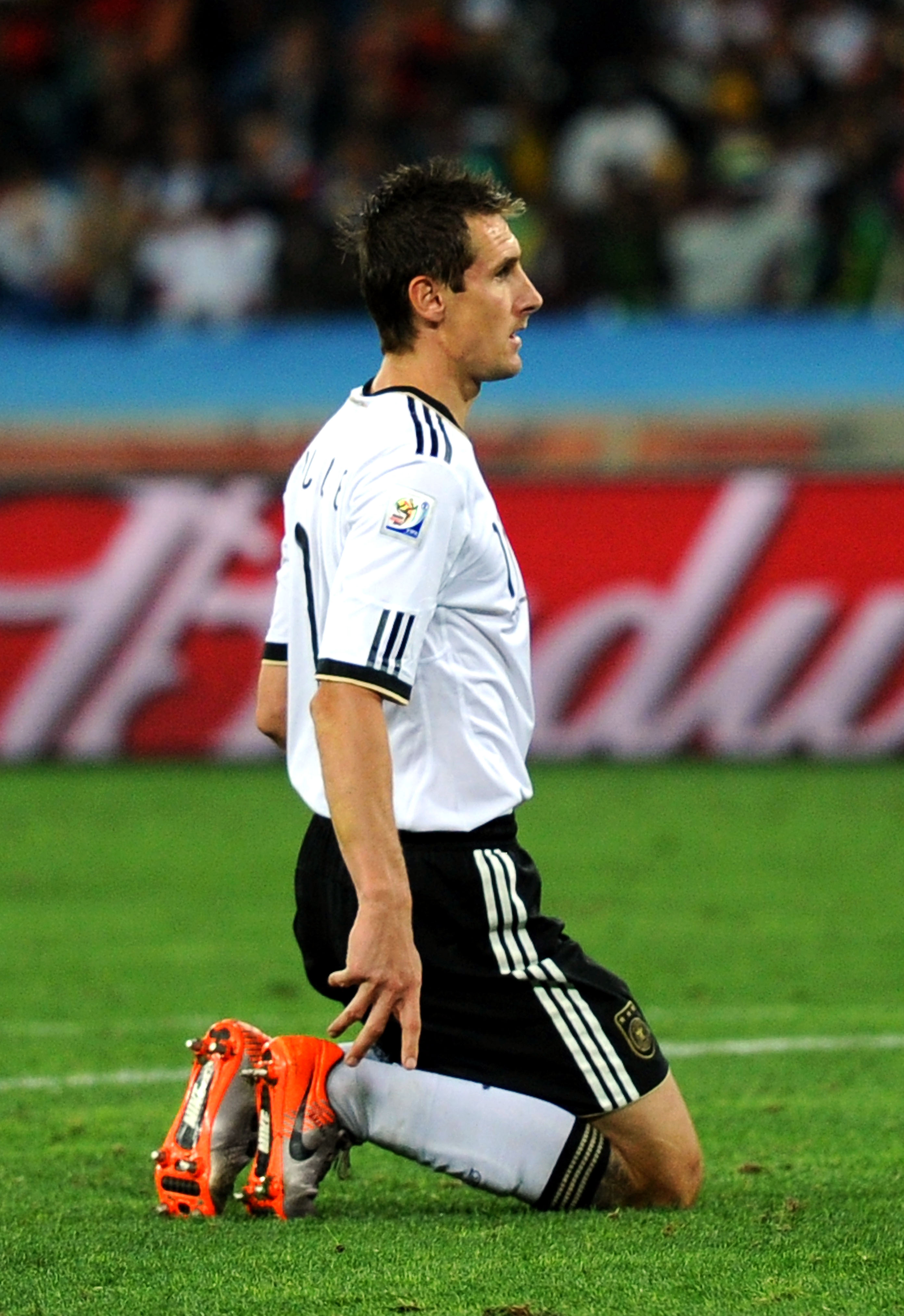 DURBAN, SOUTH AFRICA - JULY 07:  Miroslav Klose of Germany kneels on the pitch after missing a goal scoring chance during the 2010 FIFA World Cup South Africa Semi Final match between Germany and Spain at Durban Stadium on July 7, 2010 in Durban, South Af
