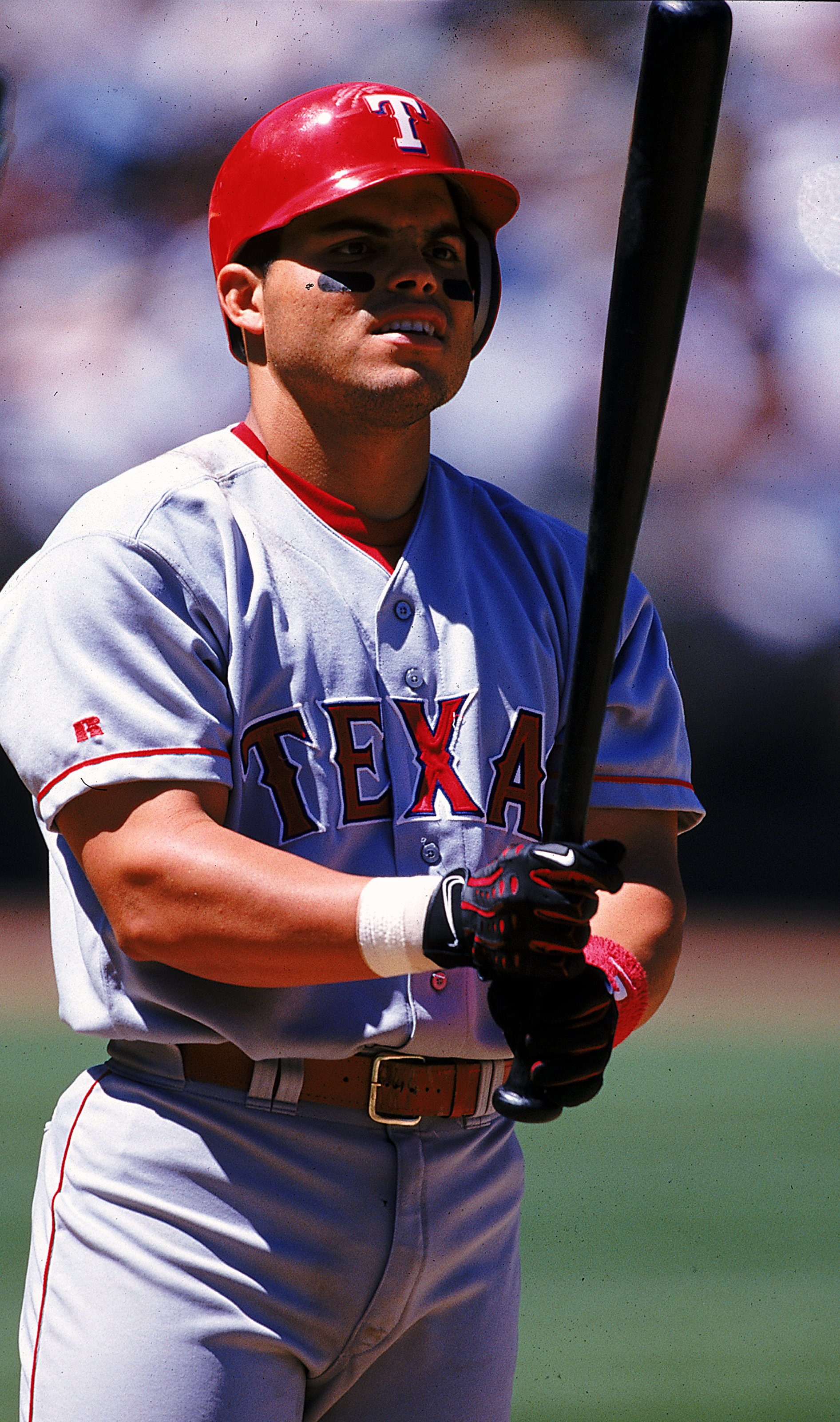 7 Jul 1999: Ivan Rodriguez of the Texas Rangers looks at his bat during the game against the Oakland Athletics at the Network Stadium in Oakland, California. The Rangers defeated the Athletics 7-4. Mandatory Credit: Jed Jacobsohn  /Allsport