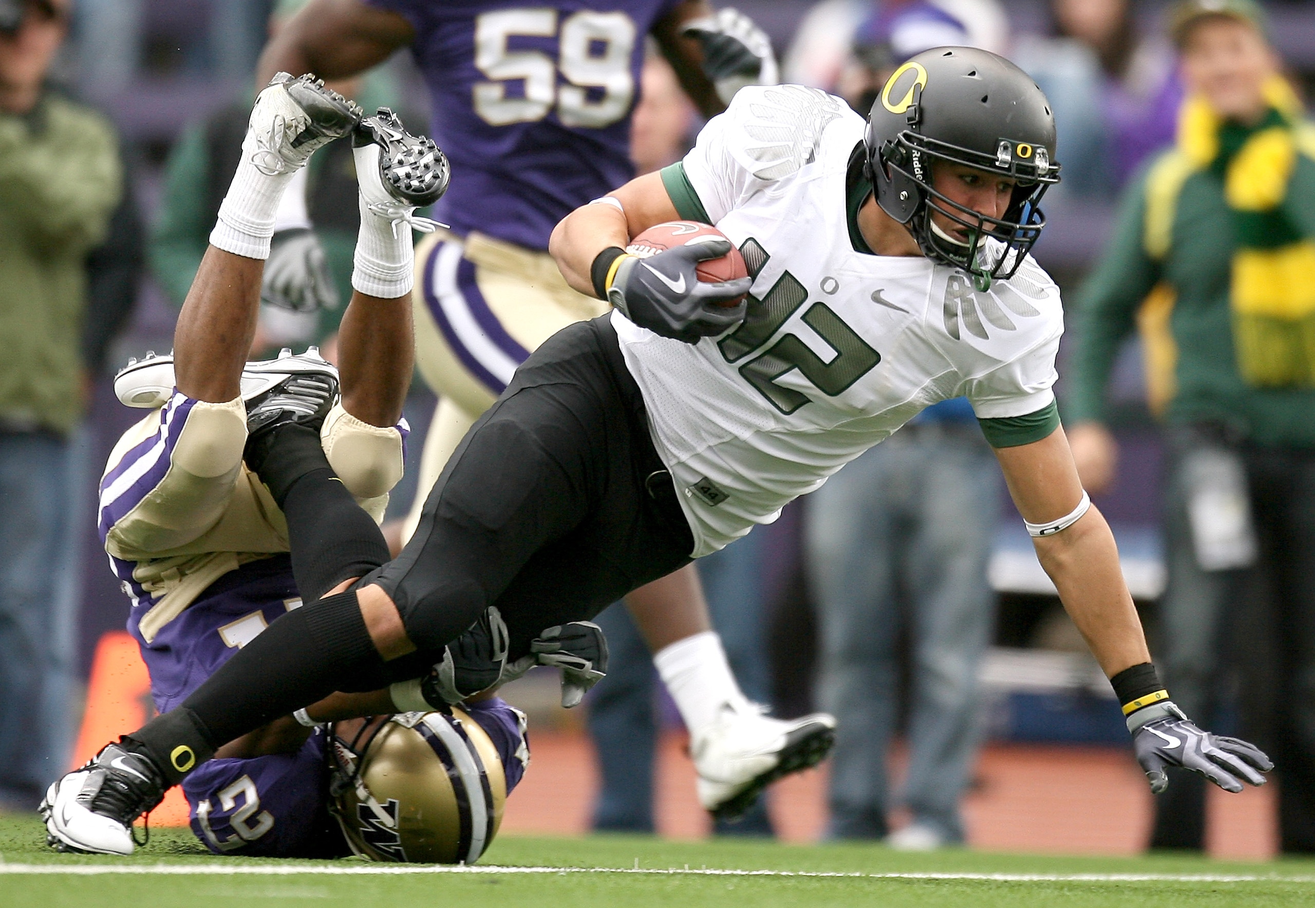 SEATTLE - OCTOBER 24: Tight end David Paulson #42 of the Oregon Ducks rushes against Adam Long #27 of the Washington Huskies on October 24, 2009 at Husky Stadium in Seattle, Washington. The Ducks defeated the Huskies 43-19. (Photo by Otto Greule Jr/Getty SEATTLE - OCTOBER 24: Tight end David Paulson #42 of the Oregon Ducks rushes against Adam Long #27 of the Washington Huskies on October 24, 2009 at Husky Stadium in Seattle, Washington. The Ducks defeated the Huskies 43-19. (Photo by Otto Greule Jr/Getty