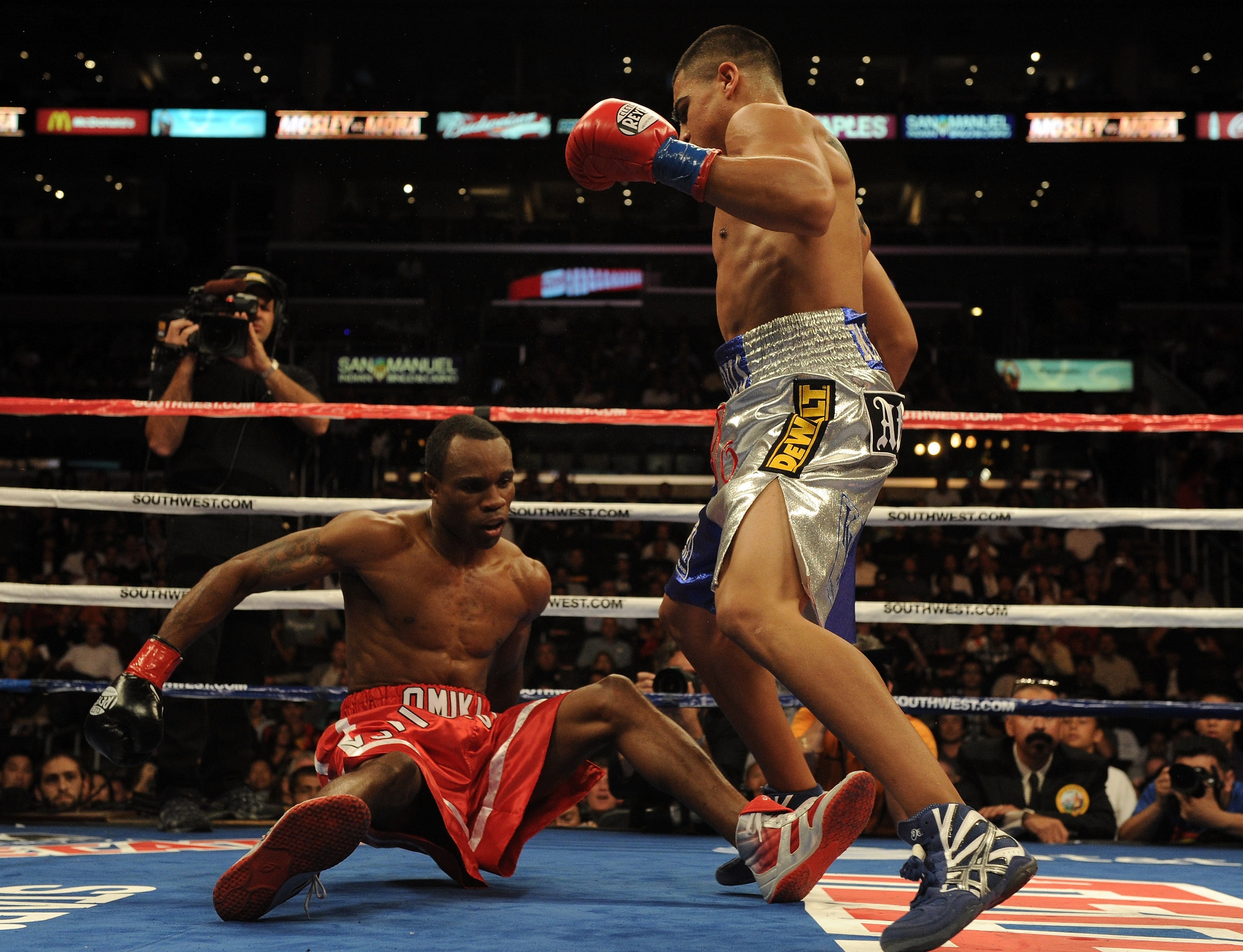 LOS ANGELES, CA - SEPTEMBER 18:  Victor Ortiz knocks down Vivian Harris during the second round in a Welterweight fight at Staples Center on September 18, 2010 in Los Angeles, California. Ortiz would win the fight in a third round knockout.  (Photo by Har