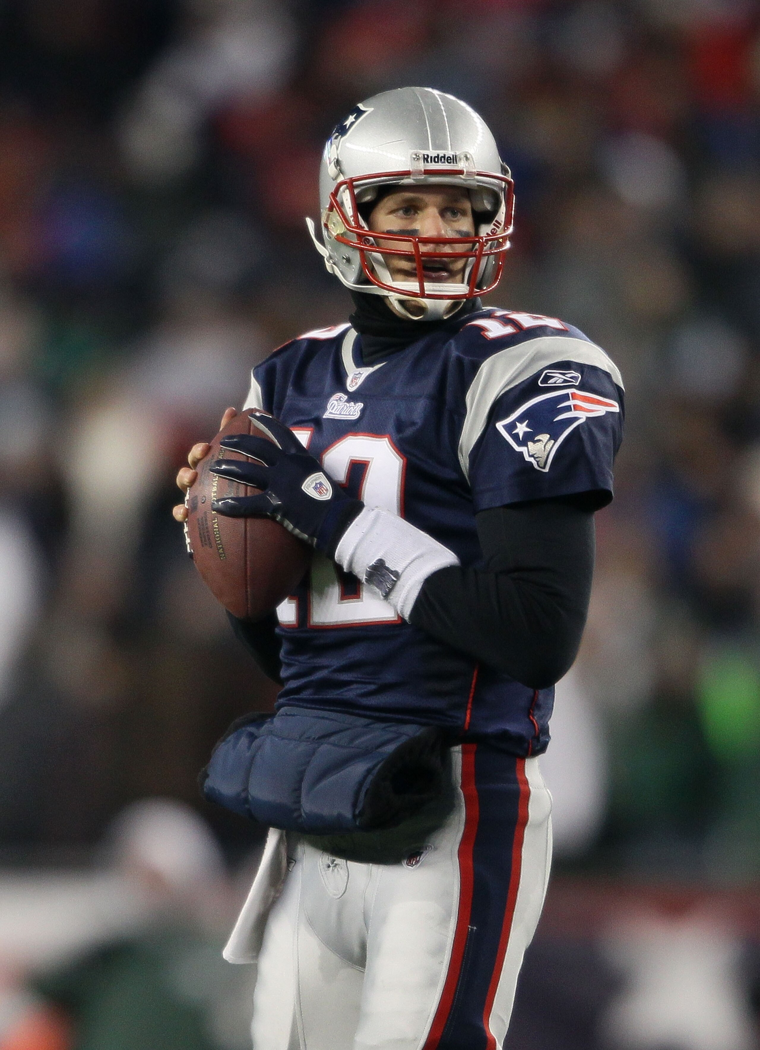 FOXBORO, MA - JANUARY 16:  Quarterback Tom Brady #12 of the New England Patriots looks to pass during their 2011 AFC divisional playoff game against the New York Jets at Gillette Stadium on January 16, 2011 in Foxboro, Massachusetts.  (Photo by Elsa/Getty