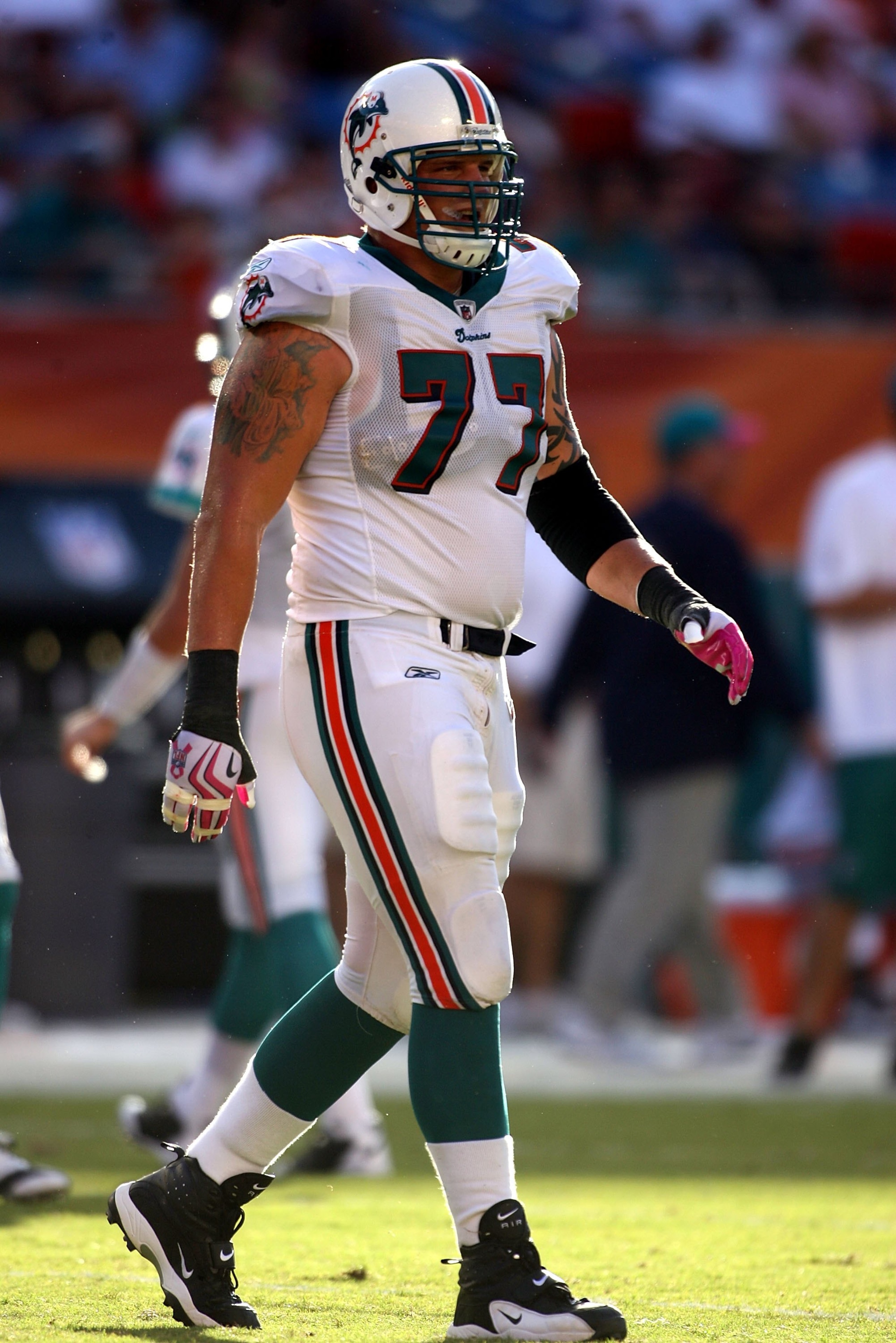 MIAMI - OCTOBER 04:  Lineman Jake Long #77 of the Miami Dolphins walks on the field against the Buffalo Bills at Land Shark Stadium on October 4, 2009 in Miami, Florida. Miami defeated Buffalo 31-30.  (Photo by Marc Serota/Getty Images)
