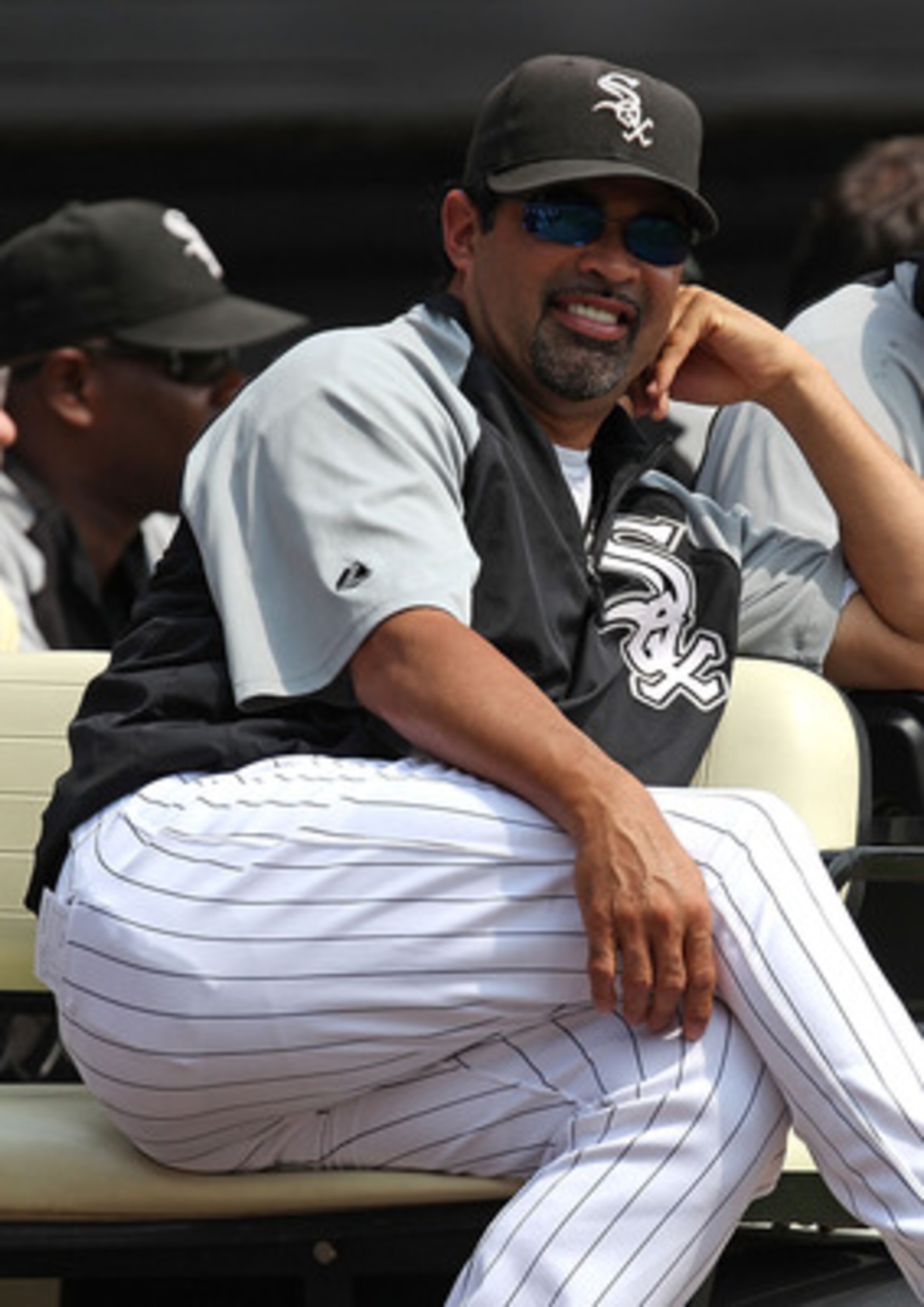 CHICAGO - AUGUST 29: Manager Ozzie Guillen #13 (L) and Mark Buehrle #56 of the Chicago White Sox enjoy a ceremony retiring former player Frank Thomas' number 35 before a game against the New York Yankees at U.S. Cellular Field on August 29, 2010 in Chicag