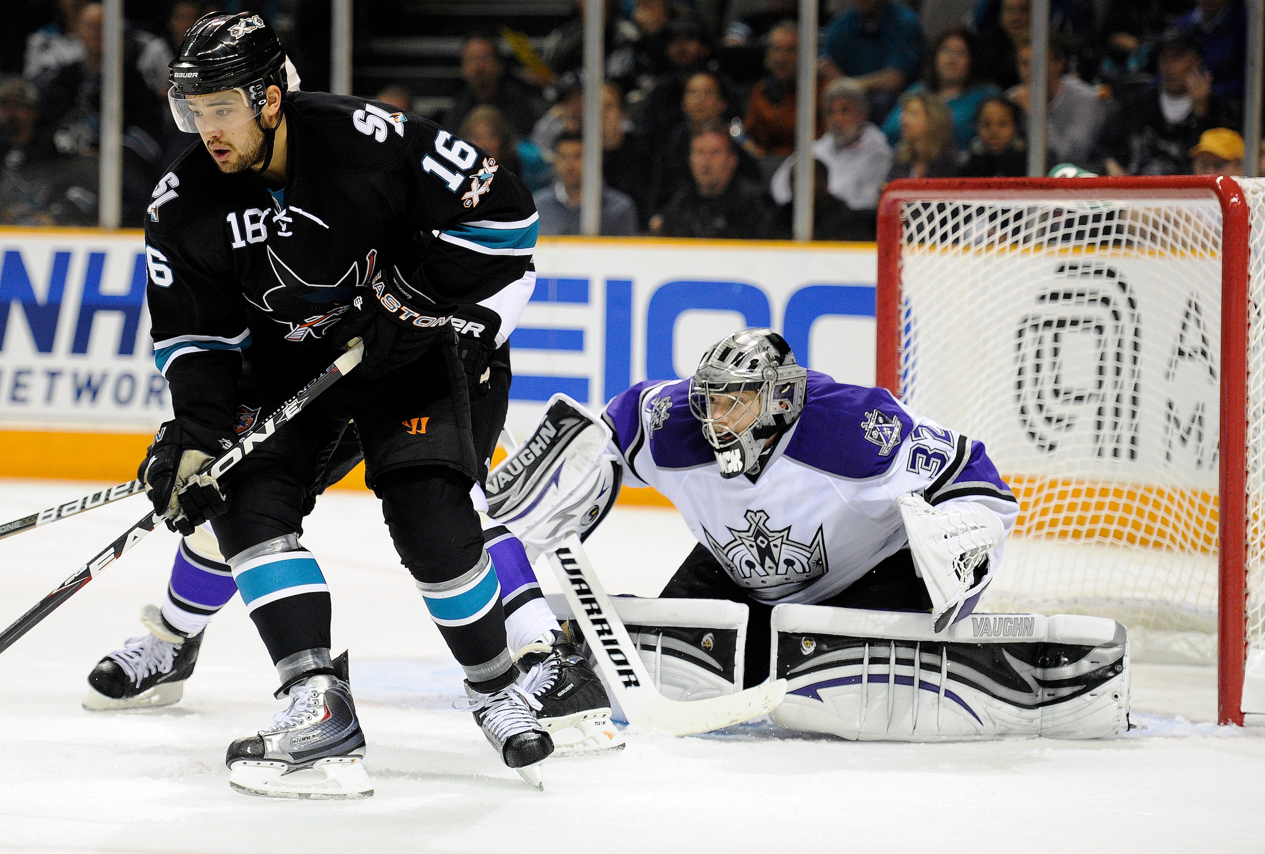 SAN JOSE, CA - APRIL 16: Jonathan Quick #32 of the Los Angeles Kings tries to keep his eye on the puck behind Devin Setoguchi #16 of the San Jose Sharks in Game Two of the Western Conference Quarterfinals during the 2011 NHL Stanley Cup Playoffs at the HP SAN JOSE, CA - APRIL 16: Jonathan Quick #32 of the Los Angeles Kings tries to keep his eye on the puck behind Devin Setoguchi #16 of the San Jose Sharks in Game Two of the Western Conference Quarterfinals during the 2011 NHL Stanley Cup Playoffs at the HP