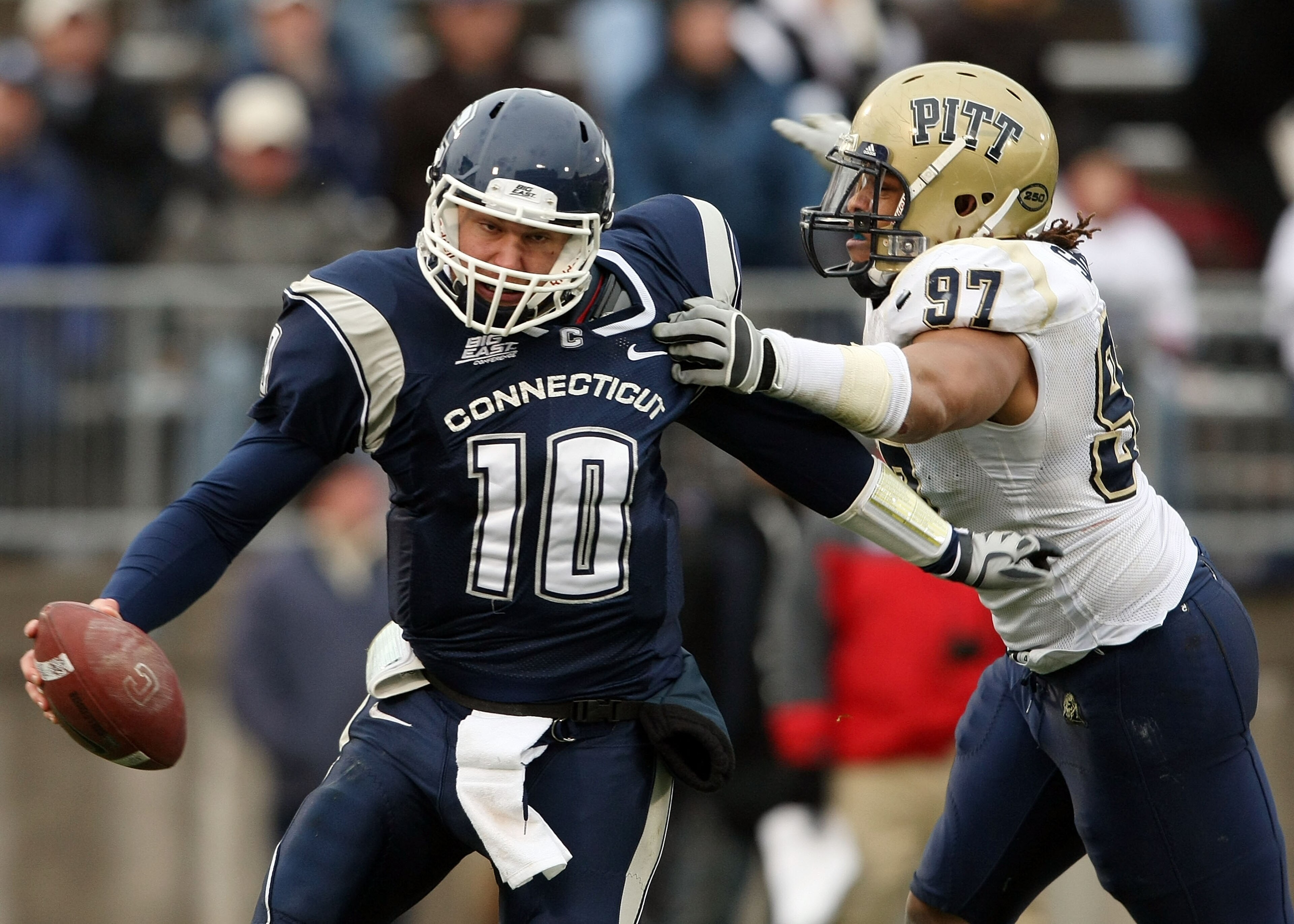 EAST HARTFORD, CT - DECEMBER 06: Zach Frazer #10 of the Connecticut Huskies narrowly escapes Jabaal Sheard #97 of the Pittsburgh Panthers on December 6, 2008 at Rentschler Field in East Hartford, Connecticut. The Panthers defeated the Huskies 34-10. (Ph EAST HARTFORD, CT - DECEMBER 06: Zach Frazer #10 of the Connecticut Huskies narrowly escapes Jabaal Sheard #97 of the Pittsburgh Panthers on December 6, 2008 at Rentschler Field in East Hartford, Connecticut. The Panthers defeated the Huskies 34-10. (Ph