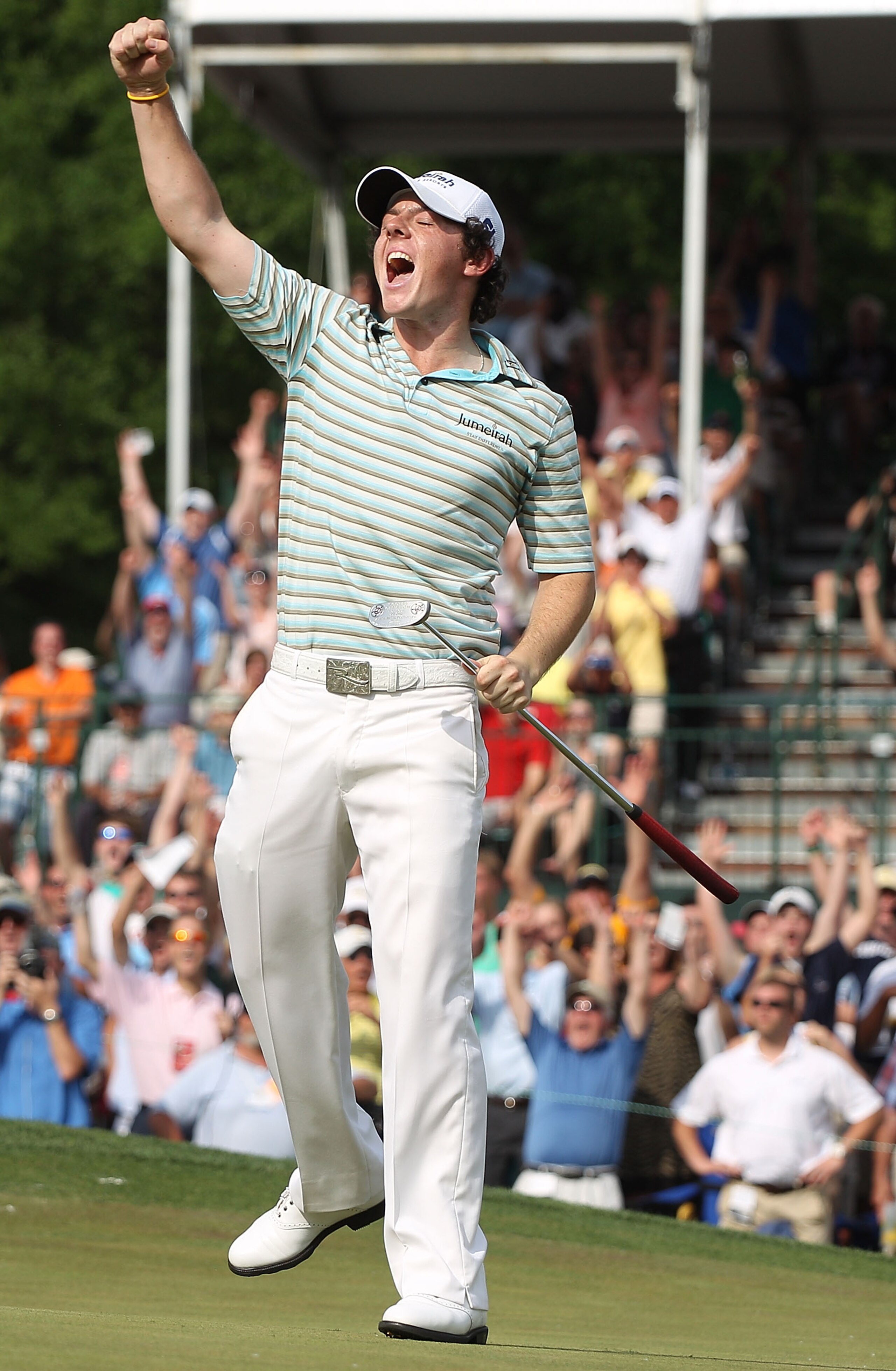 CHARLOTTE, NC - MAY 02: Rory McIlroy of Northern Ireland celebrates as he holes a birdie putt on the 18th green to secure victory during the final round of the 2010 Quail Hollow Championship at the Quail Hollow Club on May 2, 2010 in Charlotte, North Car CHARLOTTE, NC - MAY 02: Rory McIlroy of Northern Ireland celebrates as he holes a birdie putt on the 18th green to secure victory during the final round of the 2010 Quail Hollow Championship at the Quail Hollow Club on May 2, 2010 in Charlotte, North Car