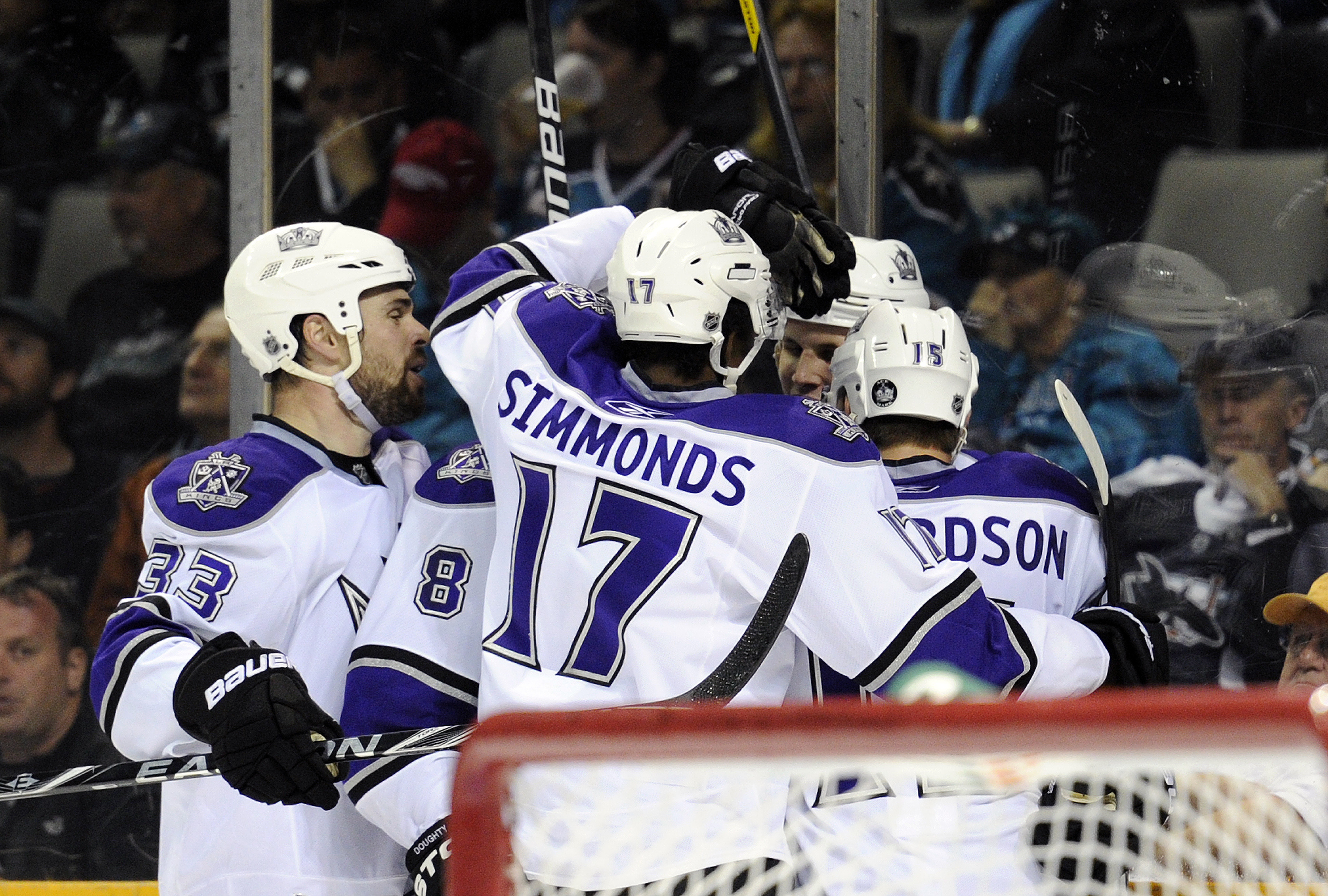 SAN JOSE, CA - APRIL 16: Kyle Clifford #13 of the Los Angeles Kings scores a goal and celebrates with teammates, Willie Mitchell #33, Wayne Simmonds #17, Drew Doughty #8 and Brad Richardson #15 during a game against the San Jose Sharks in Game Two of the