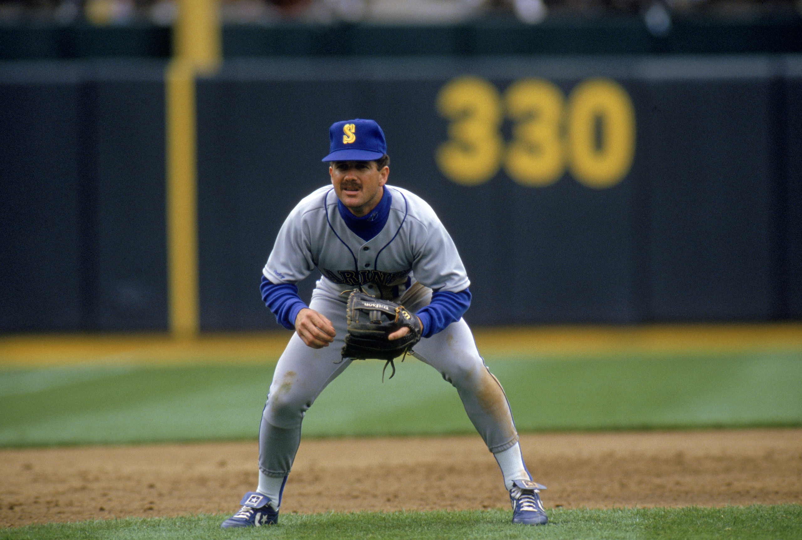 OAKLAND, CA - 1990: Edgar Martinez #11 of the Seattle Mariners focuses on home plate as he prepares for a play during a game against the Oakland Athletics in 1990 at Oakland-Alameda County Coliseum in Oakland, California. (Photo by Otto Greule Jr/Getty OAKLAND, CA - 1990: Edgar Martinez #11 of the Seattle Mariners focuses on home plate as he prepares for a play during a game against the Oakland Athletics in 1990 at Oakland-Alameda County Coliseum in Oakland, California. (Photo by Otto Greule Jr/Getty