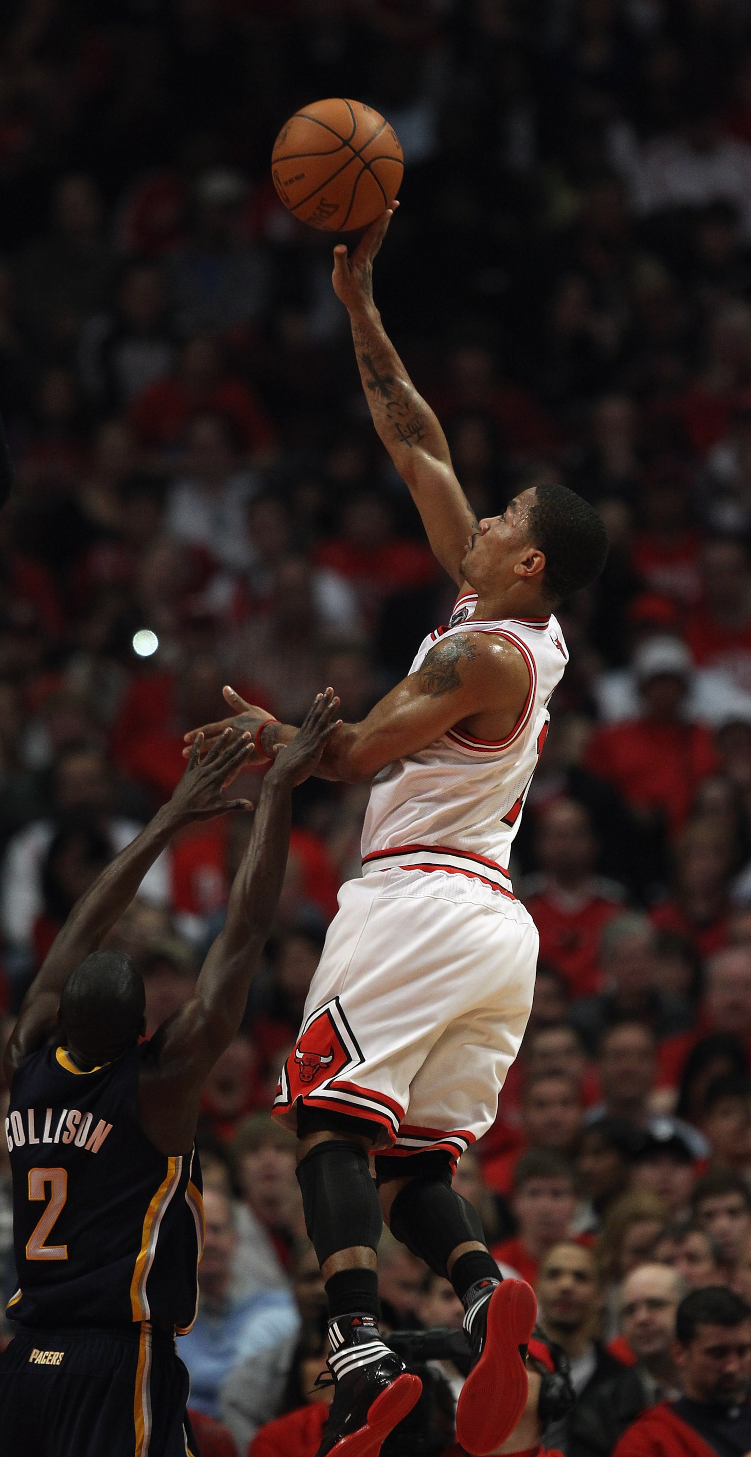 CHICAGO, IL - APRIL 16: Derrick Rose #1 of the Chicago Bulls puts up a shot over Darren Collison #2 of the Indiana Pacers in Game One of the Eastern Conference Quarterfinals in the 2011 NBA Playoffs at the United Center on April 16, 2011 in Chicago, Illin CHICAGO, IL - APRIL 16: Derrick Rose #1 of the Chicago Bulls puts up a shot over Darren Collison #2 of the Indiana Pacers in Game One of the Eastern Conference Quarterfinals in the 2011 NBA Playoffs at the United Center on April 16, 2011 in Chicago, Illin