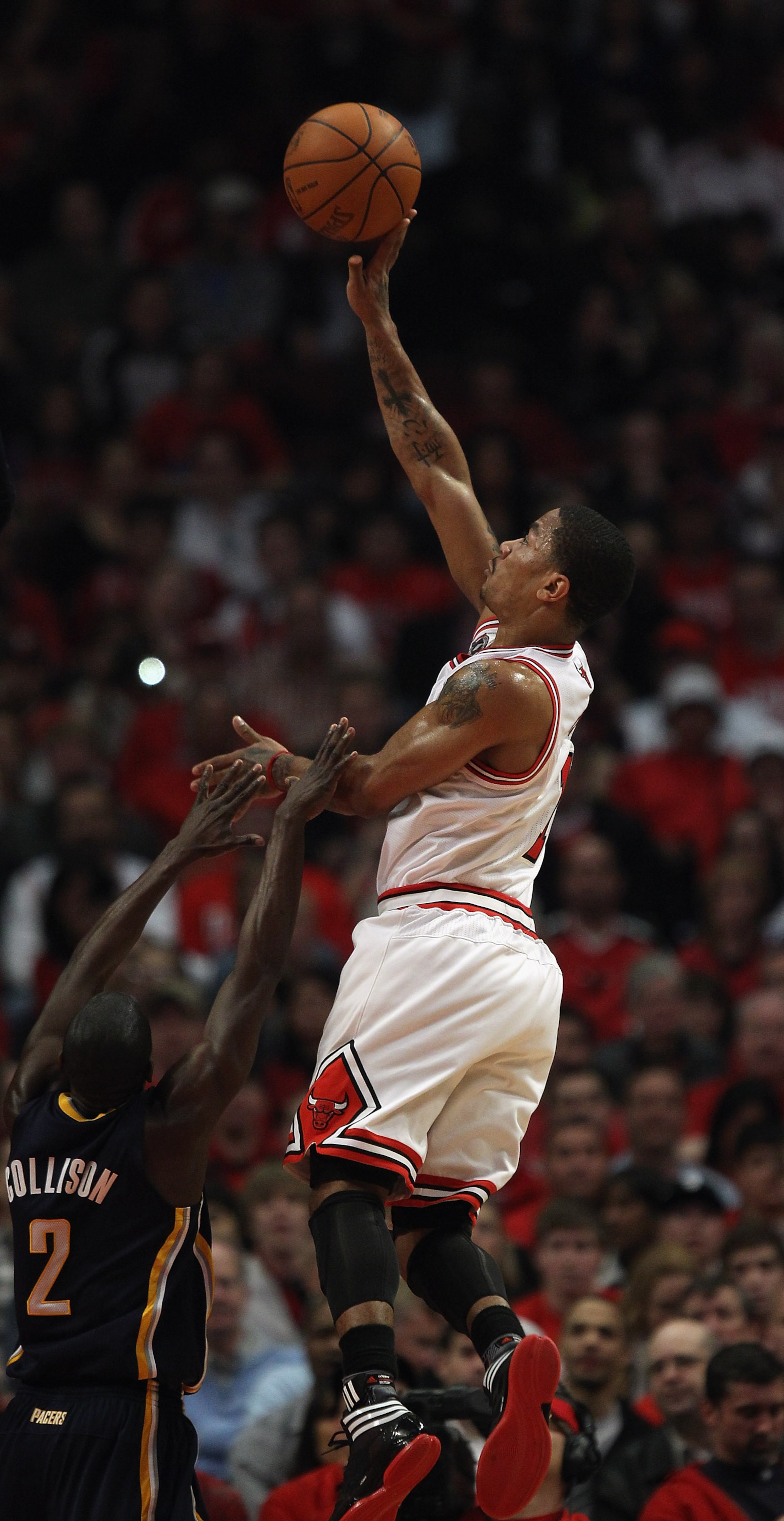 CHICAGO, IL - APRIL 16: Derrick Rose #1 of the Chicago Bulls puts up a shot over Darren Collison #2 of the Indiana Pacers in Game One of the Eastern Conference Quarterfinals in the 2011 NBA Playoffs at the United Center on April 16, 2011 in Chicago, Illin