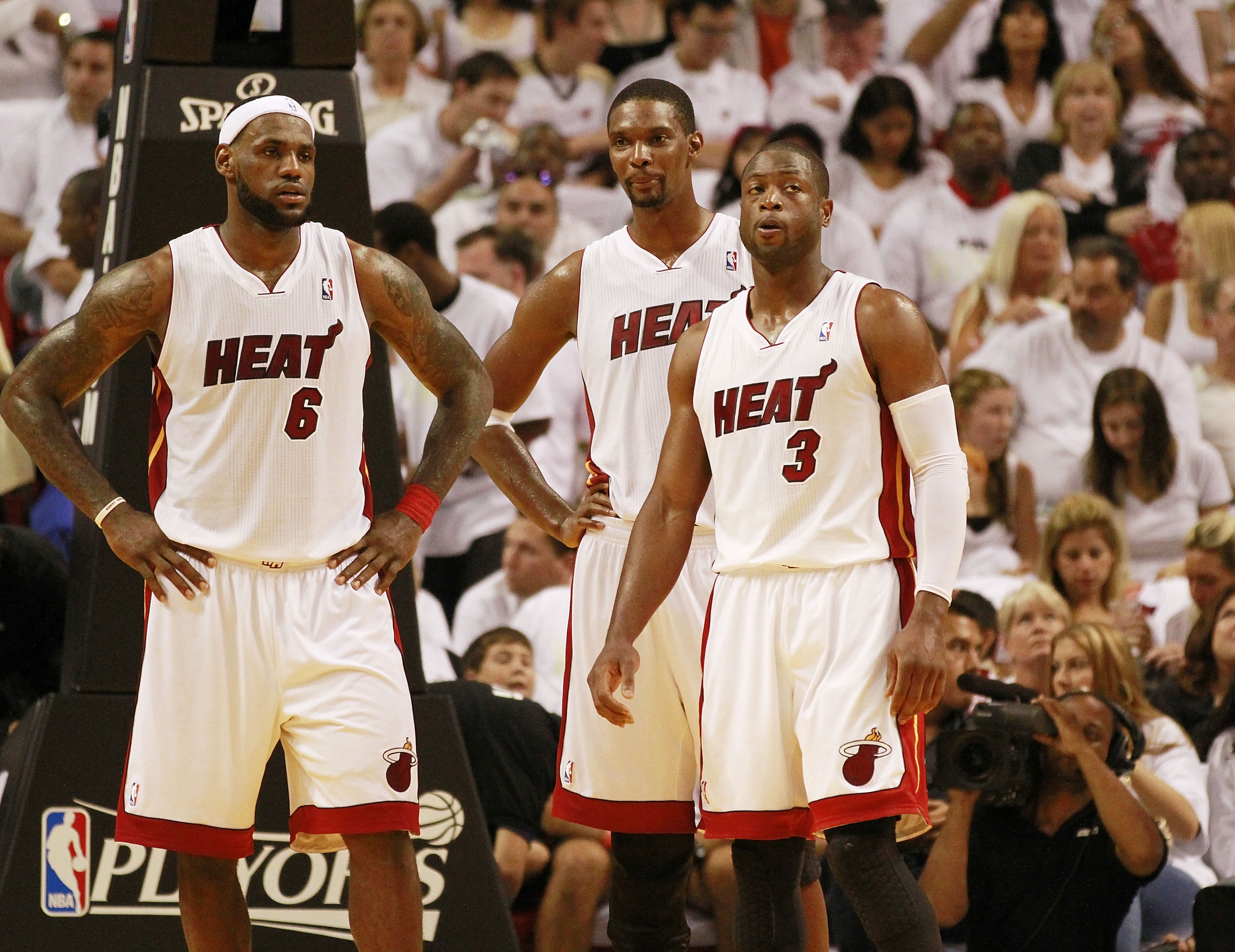 MIAMI, FL - APRIL 16: Forward Chris Bosh #1 of the Miami Heat with teammates Dwyane Wade #3 and LeBron James #6 against the Philadelphia 76ers at the American Airlines Arena in game one of the Eastern Conference Quarterfinals in the 2011 NBA Playoffs on MIAMI, FL - APRIL 16: Forward Chris Bosh #1 of the Miami Heat with teammates Dwyane Wade #3 and LeBron James #6 against the Philadelphia 76ers at the American Airlines Arena in game one of the Eastern Conference Quarterfinals in the 2011 NBA Playoffs on