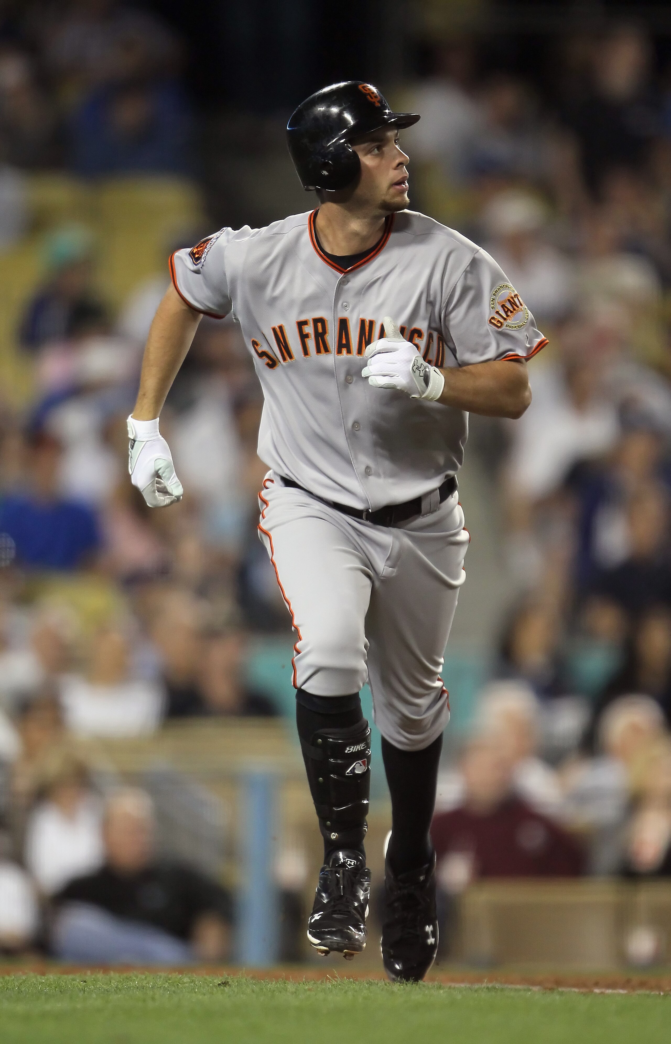 LOS ANGELES, CA - APRIL 01:  Brandon Belt #9 of the San Francisco Giants trots to first base after hitting a three-run homerun against the Los Angeles Dodgers in the fourth inning at Dodger Stadium on April 1, 2011 in Los Angeles, California.  (Photo by J