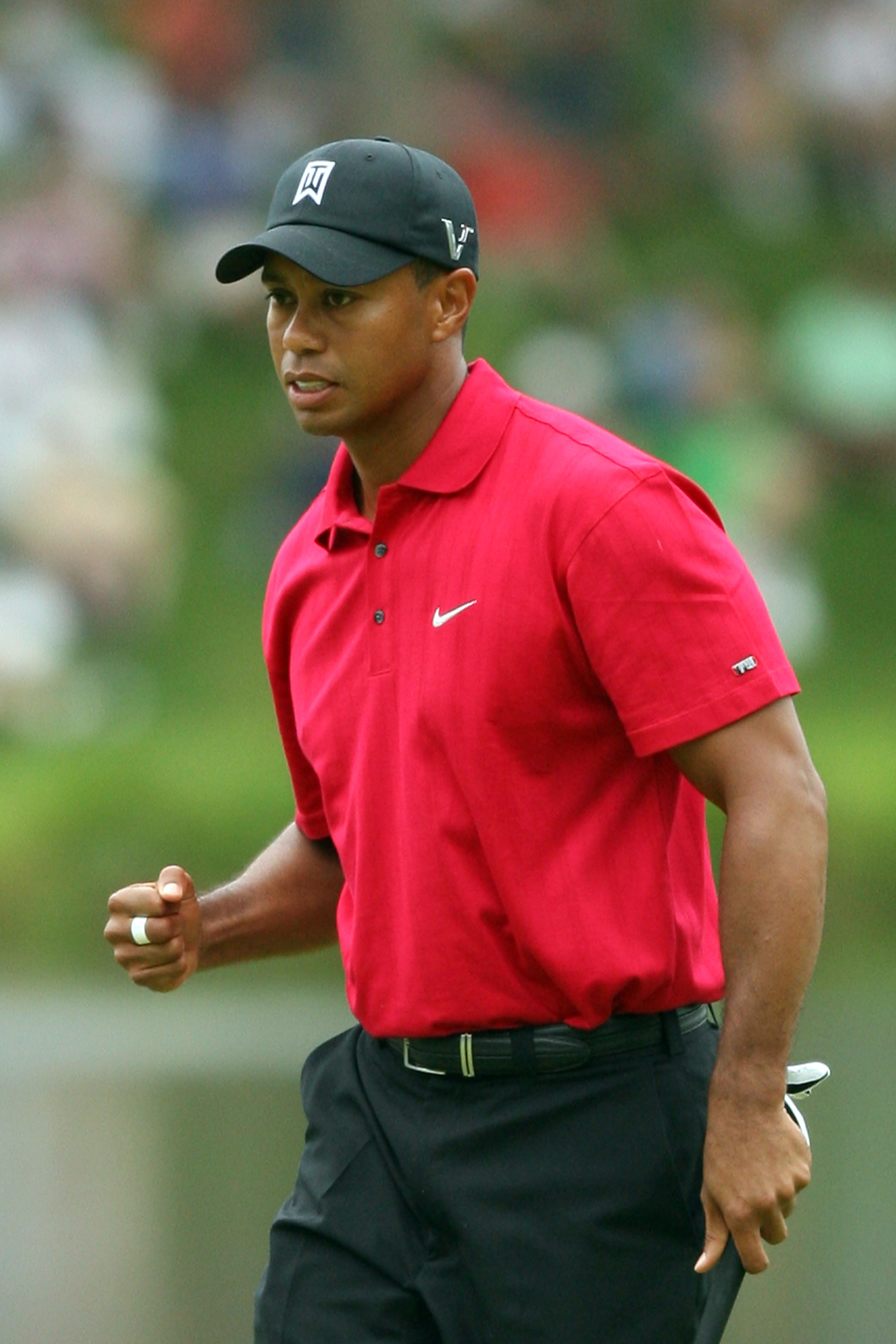 BETHESDA, MD - JULY 05: Tiger Woods reacts to his shot during the final round of the AT&T National hosted by Tiger Woods at Congressional Country Club on July 5, 2009 in Bethesda, Maryland. (Photo by Hunter Martin/Getty Images) BETHESDA, MD - JULY 05: Tiger Woods reacts to his shot during the final round of the AT&T National hosted by Tiger Woods at Congressional Country Club on July 5, 2009 in Bethesda, Maryland. (Photo by Hunter Martin/Getty Images)