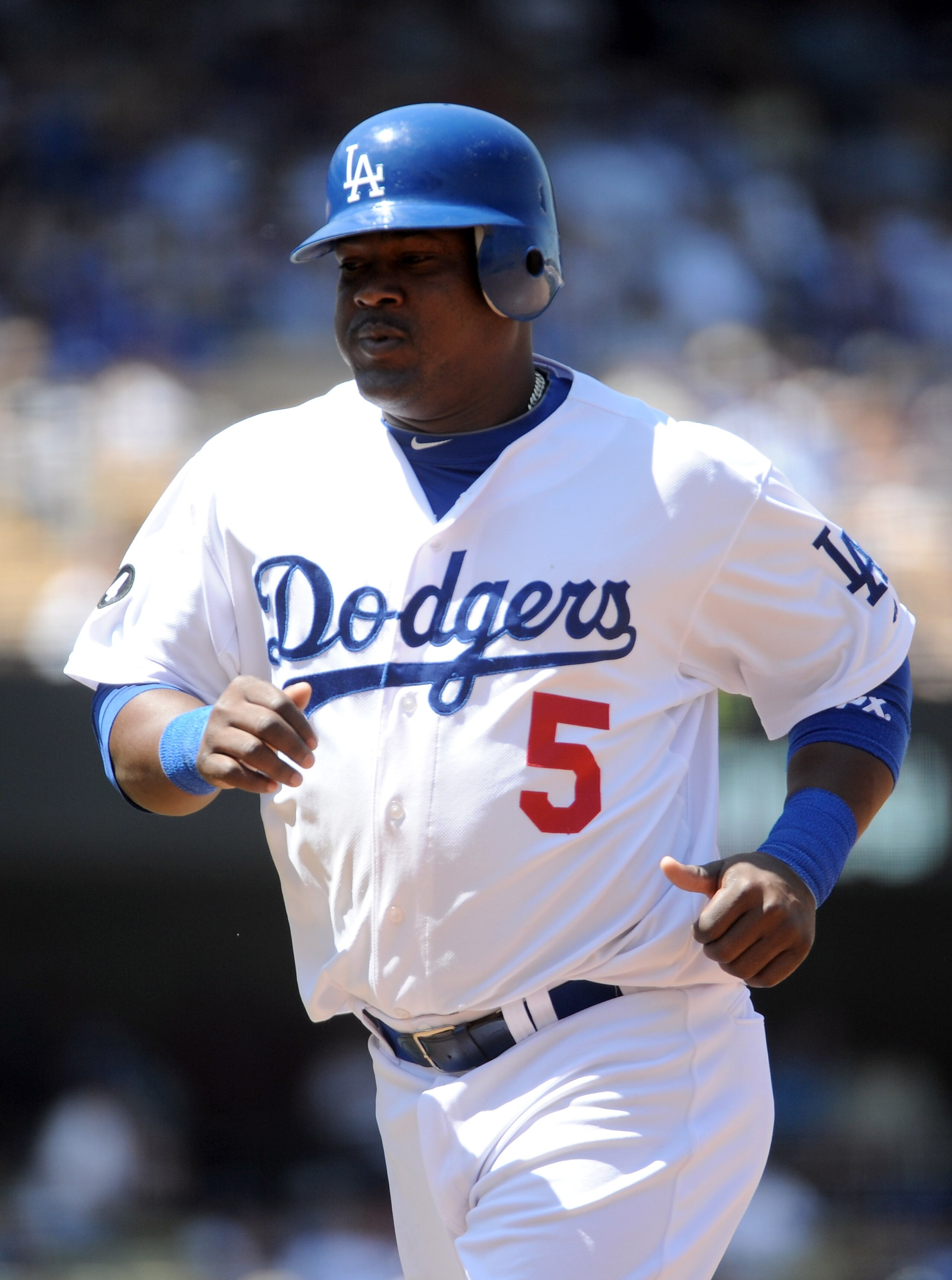 LOS ANGELES, CA - APRIL 17:  Juan Uribe #5 of the Los Angeles Dodgers leaves the field against the St Louis Cardinals at Dodger Stadium on April 17, 2011 in Los Angeles, California.  (Photo by Harry How/Getty Images)