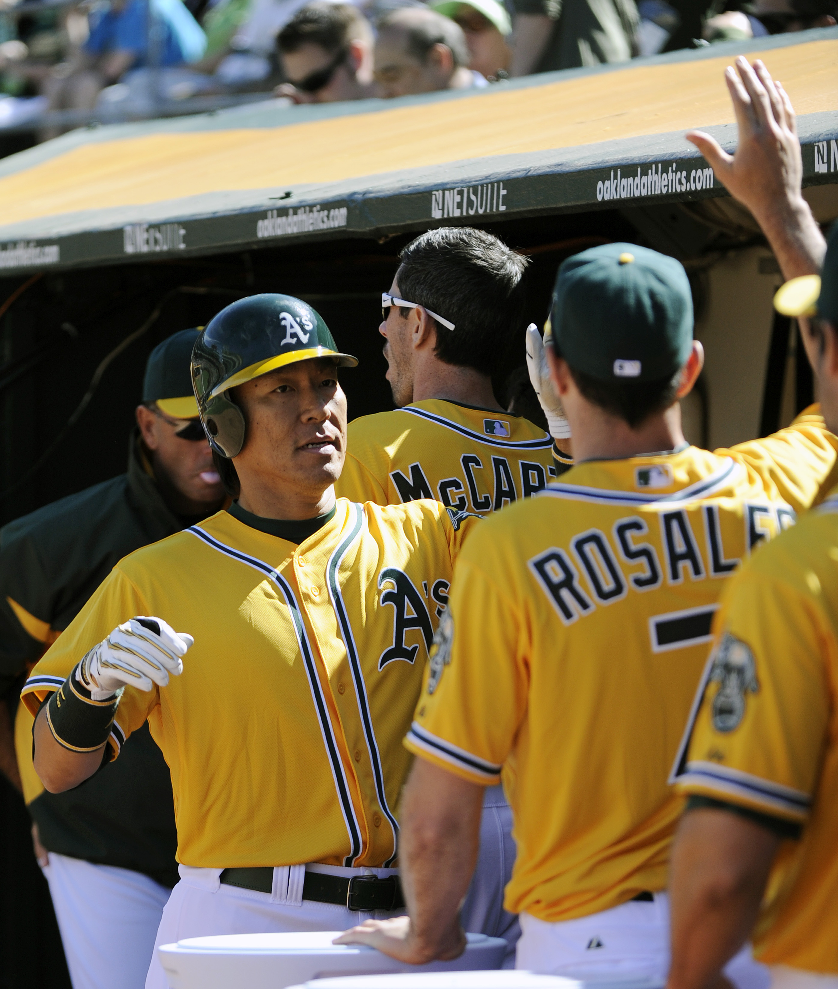 OAKLAND, CA - APRIL 3: Hideki Matsui #55 of the Oakland Athletics gets a high-fives from teammates in the dougout after scoring a run against the Seattle Mariners during a MLB baseball game at the Oakland-Alameda County Coliseum April 3, 2011 in Oakland, 