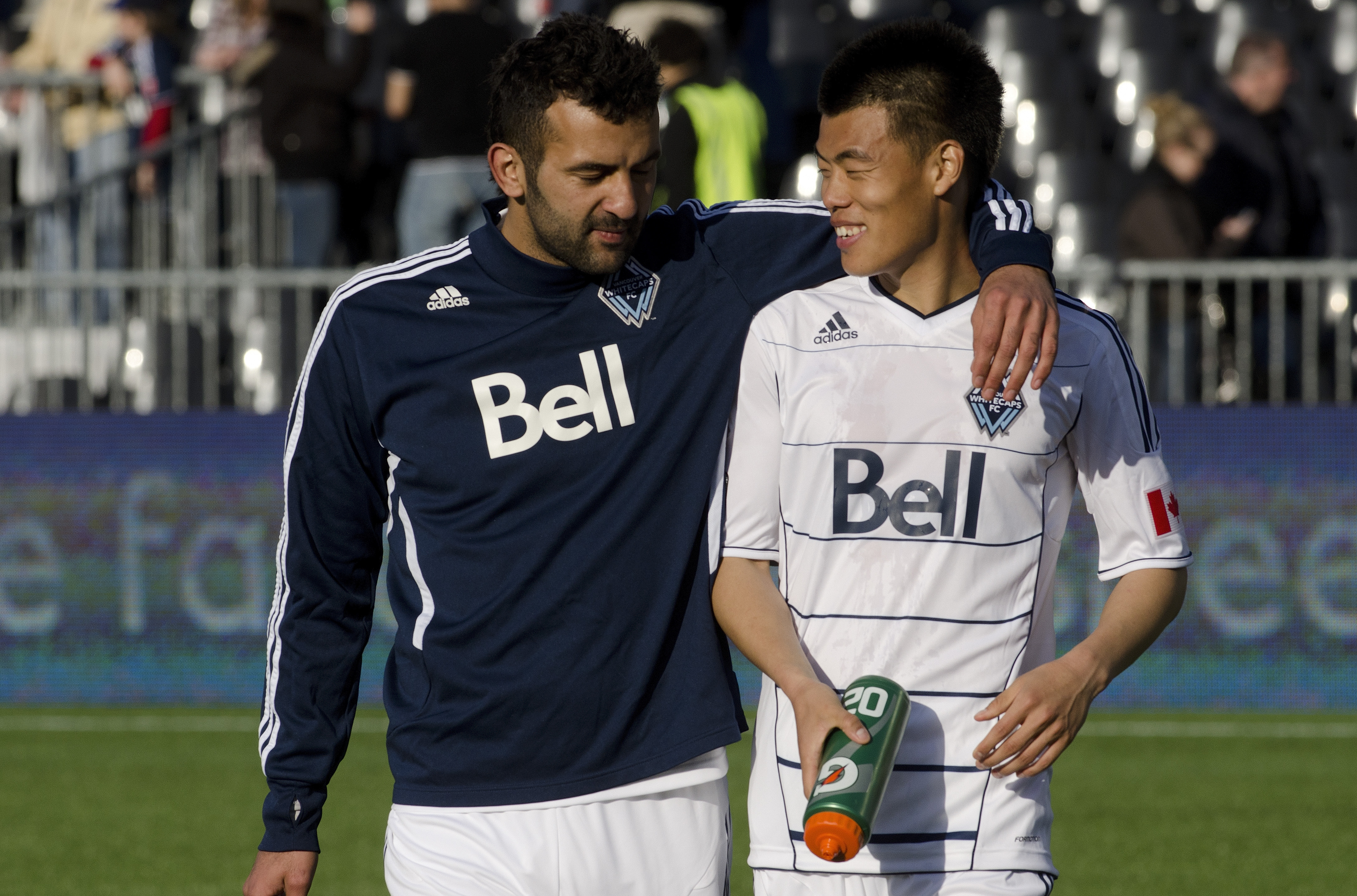 VANCOUVER, CANADA - APRIL 16: Mouloud Akloul #50 and Long Tan #23 of the Vancouver Whitecaps FC walk off the field after playing to a draw against the Chivas USA in MLS action on April 16, 2011 at Empire Field in Vancouver, BC, Canada. (Photo by Rich Lam