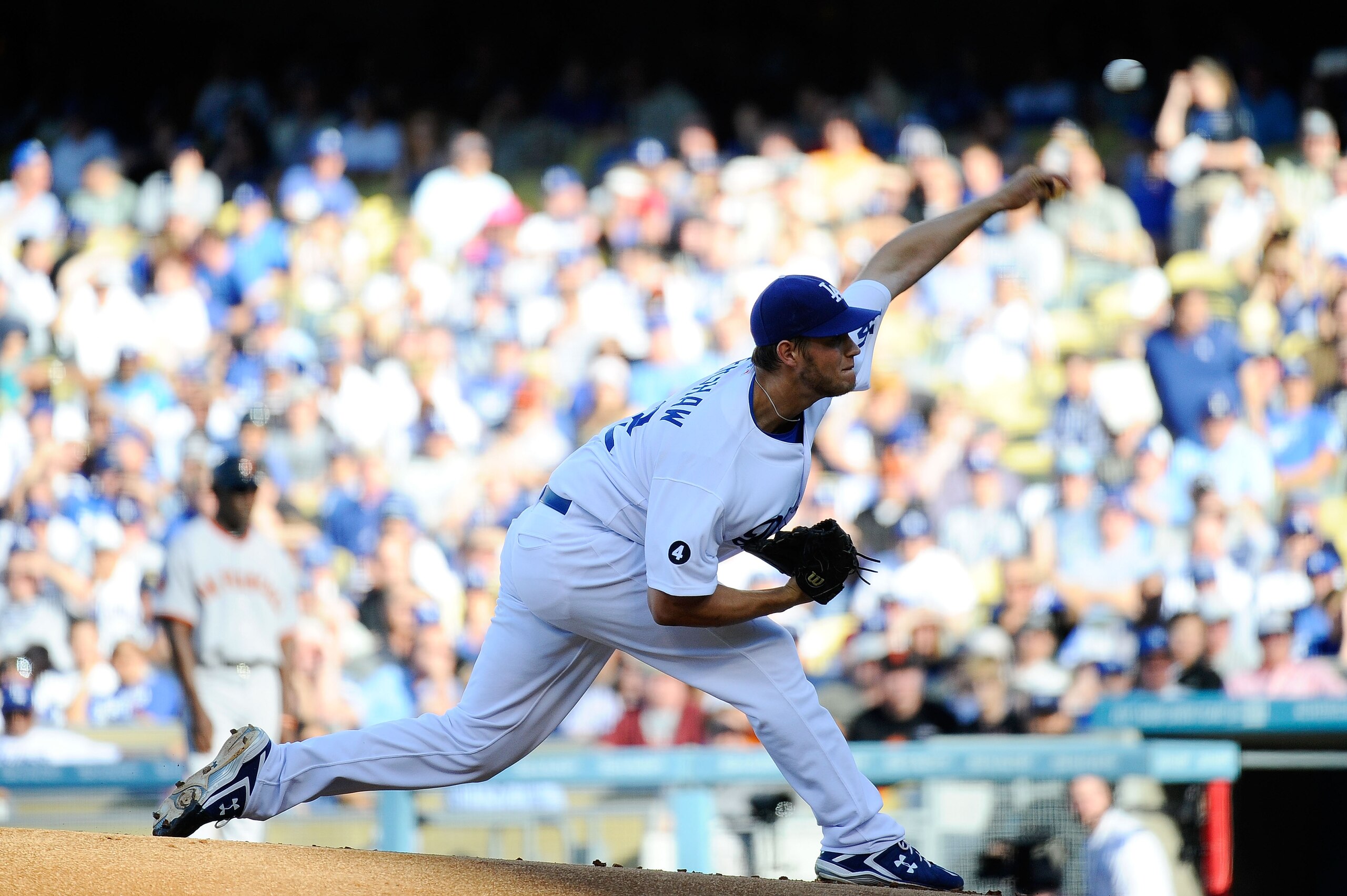 LOS ANGELES, CA - MARCH 31:  Clayton Kershaw #22 of the Los Angeles Dodgers throws a pitch against the San Francisco Giants on Opening Day at Dodger Stadium on March 31, 2011 in Los Angeles, California.  (Photo by Kevork Djansezian/Getty Images)
