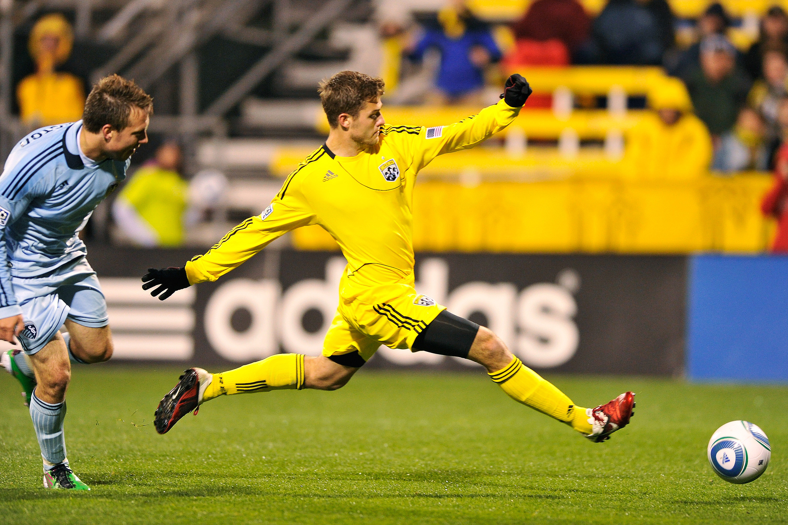 COLUMBUS, OH - APRIL 16: Robbie Rogers #18 of the Columbus Crew leaps to make the kick to score the only goal during a 1-0 Columbus victory over Sporting Kansas City on April 16, 2011 at Crew Stadium in Columbus, Ohio. (Photo by Jamie Sabau/Getty Images