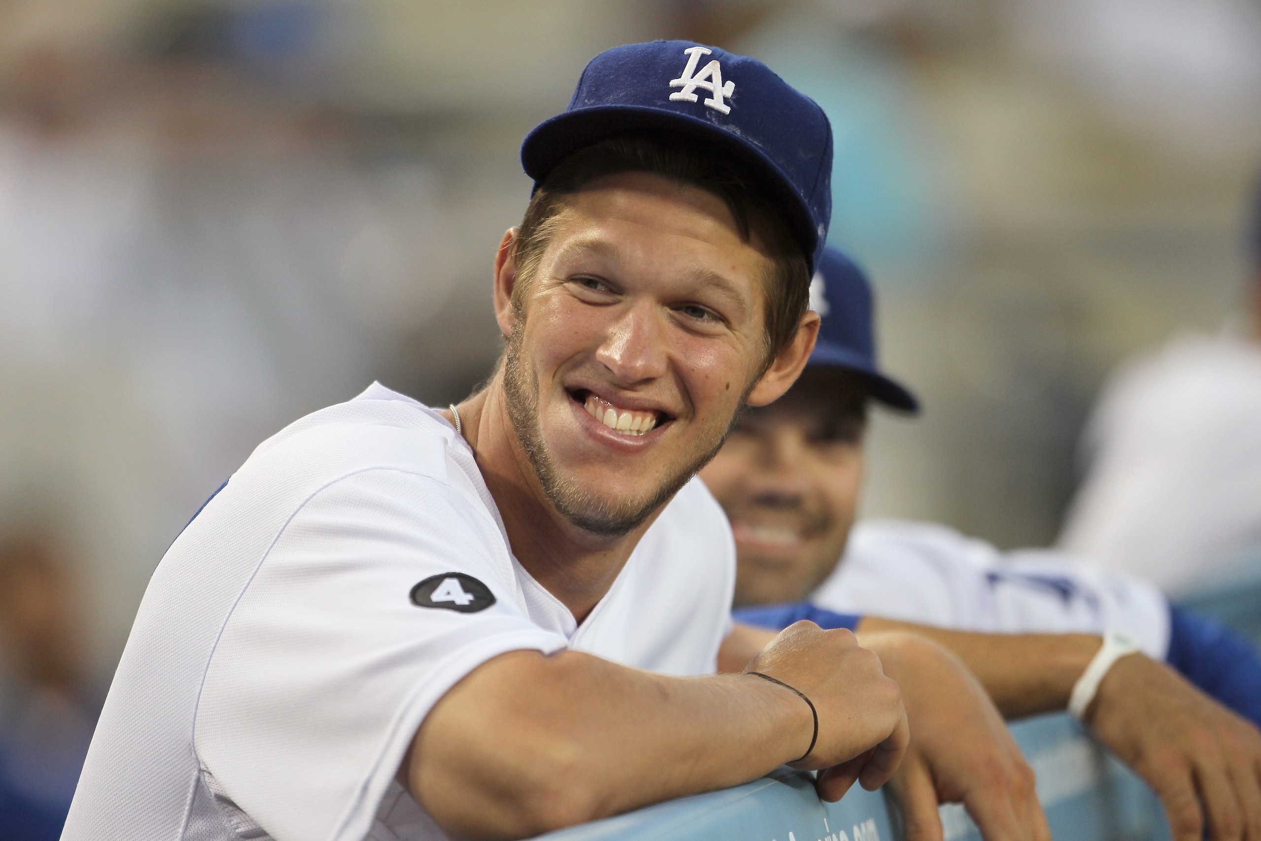 LOS ANGELES, CA - APRIL 01:  Clayton Kershaw #22 of the Los Angeles Dodgers looks on from the dugout against the San Francisco Giants at Dodger Stadium on April 1, 2011 in Los Angeles, California.  (Photo by Jeff Gross/Getty Images)