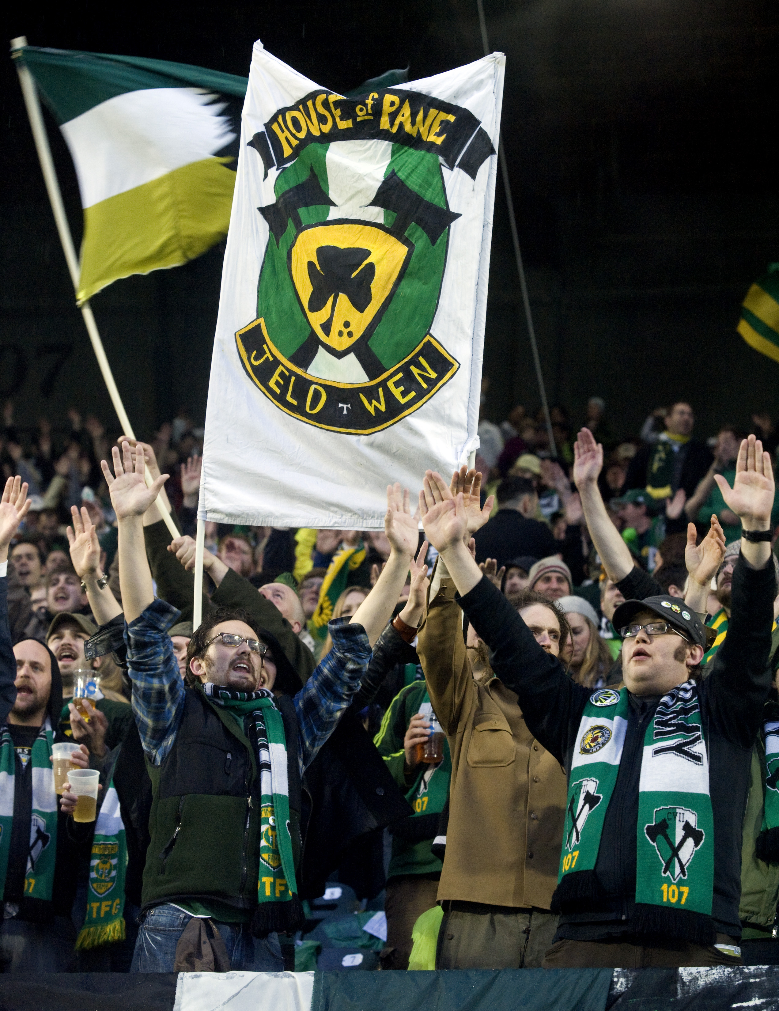 PORTLAND, OR - APRIL 14: Portland Timbers fans stand in the pouring rain as they cheer before the start of the teams home opening game at Jeld-Wen Field on April 14, 2011 in Portland, Oregon. (Photo by Steve Dykes/Getty Images)