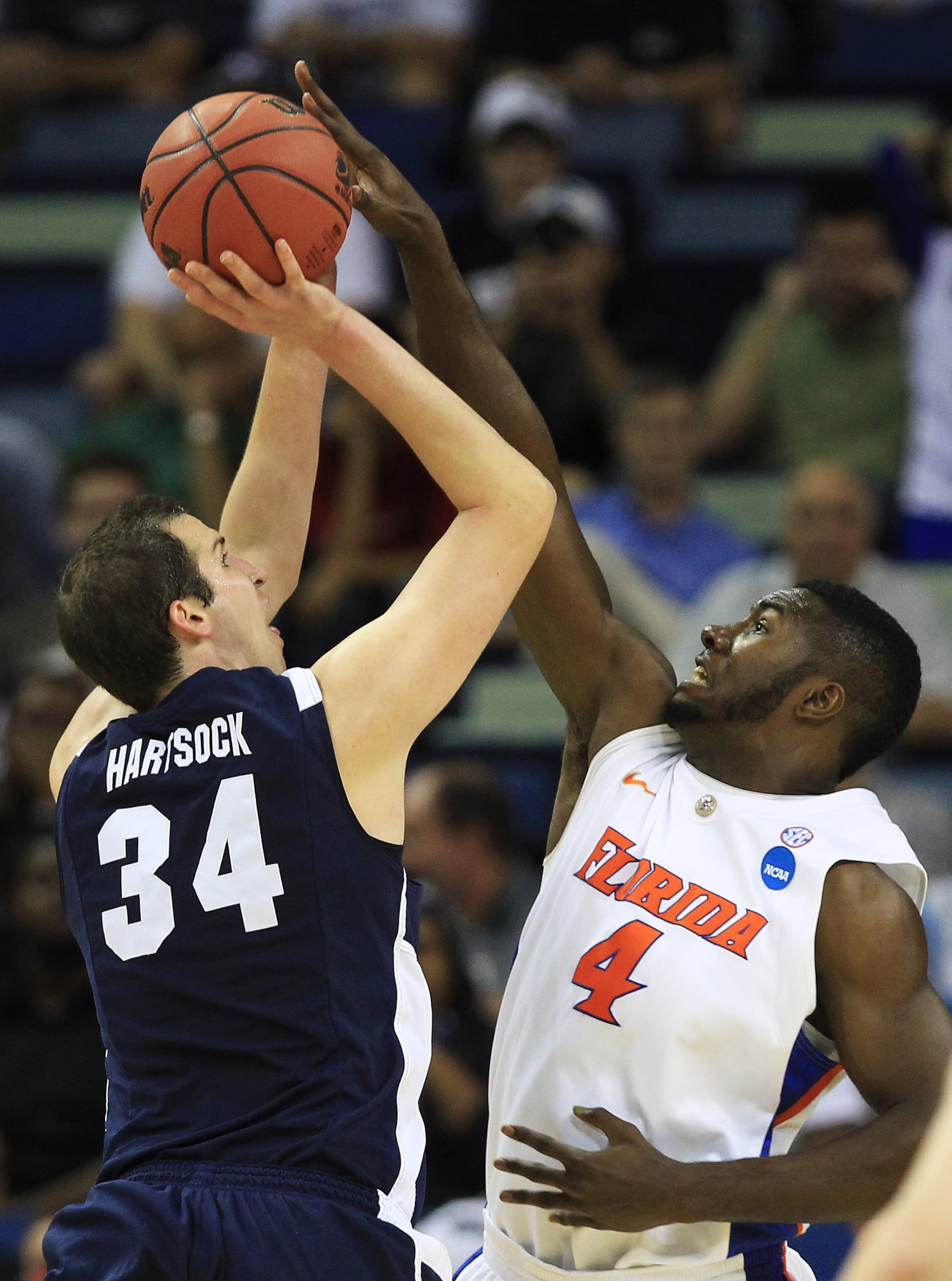 NEW ORLEANS, LA - MARCH 24:  Noah Hartsock #34 of the Brigham Young Cougars shoots over Patric Young #4 of the Florida Gators during the Southeast regional of the 2011 NCAA men's basketball tournament at New Orleans Arena on March 24, 2011 in New Orleans,