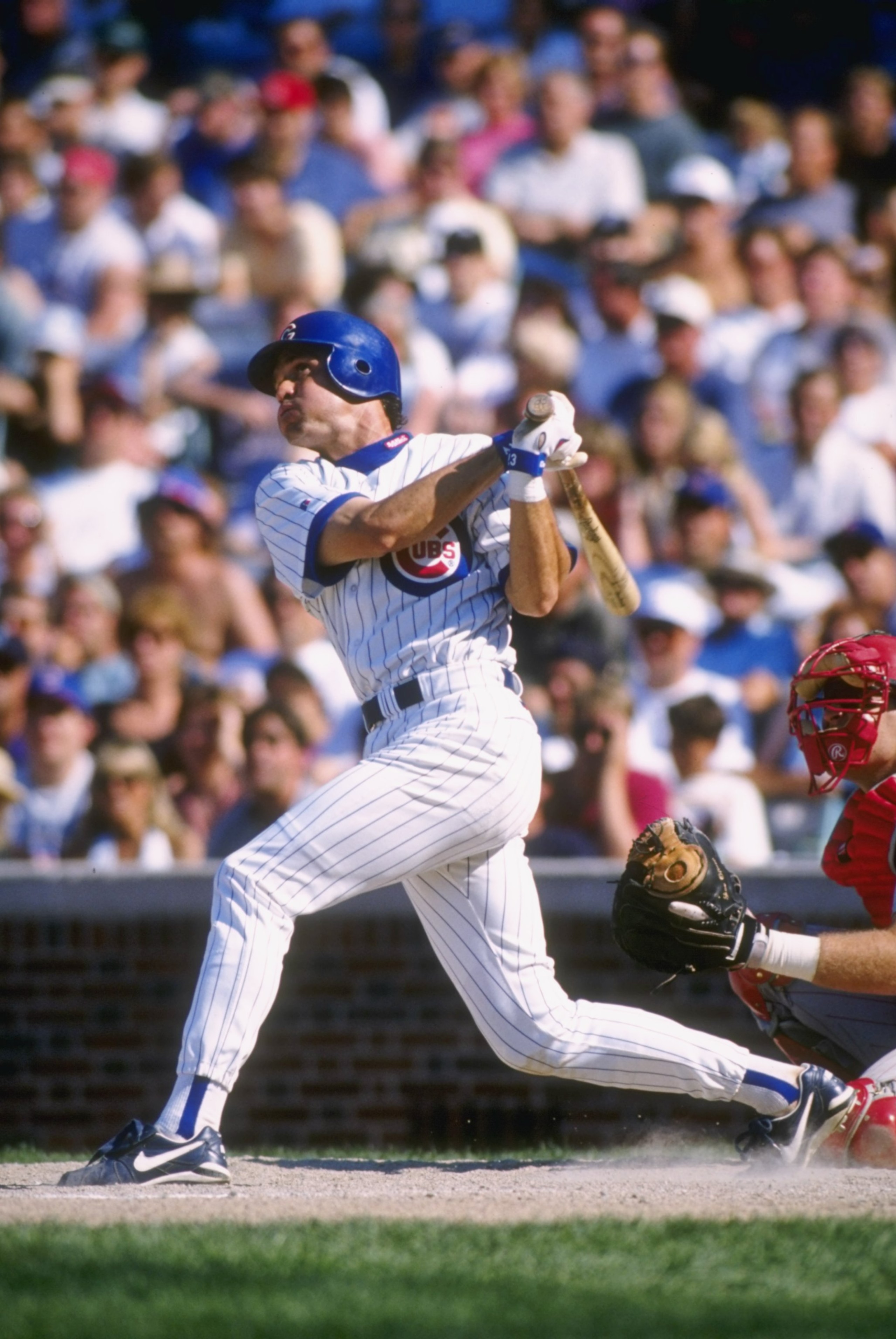 5 Jul 1996: Second baseman Ryne Sandberg of the Chicago Cubs stares into the out field as he follows through on a swing following a hit in the Cubs 3-0 loss to the Cincinnati Reds at Wrigley Field in Chicago, Illinois.  Mandatory Credit: Jonathan Daniel