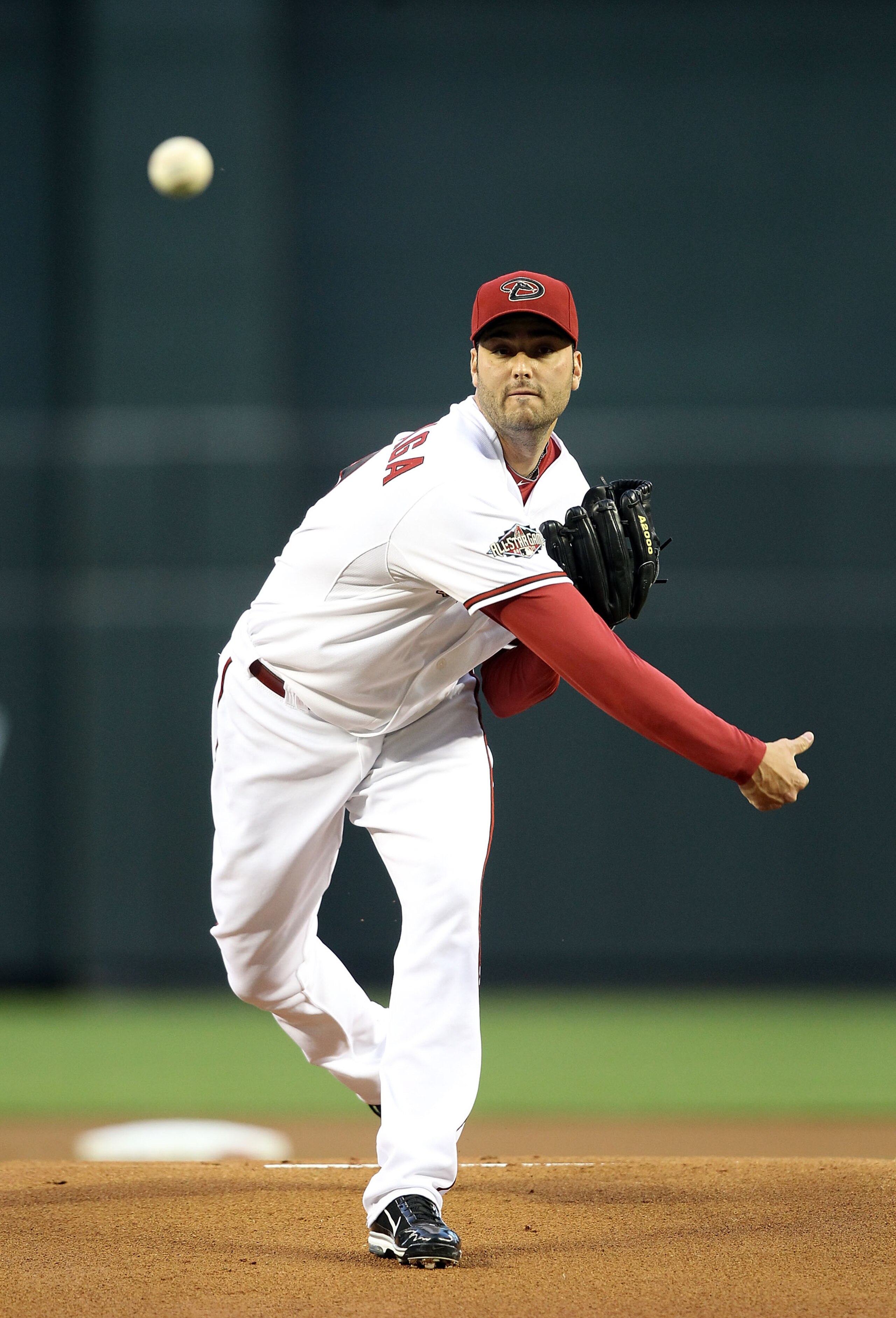 PHOENIX, AZ - APRIL 12:  Starting pitcher Armando Galarraga #56 of the Arizona Diamondbacks pitches against the St. Louis Cardinals during the Major League Baseball game at Chase Field on April 12, 2011 in Phoenix, Arizona.  The Diamondbacks defeated the 