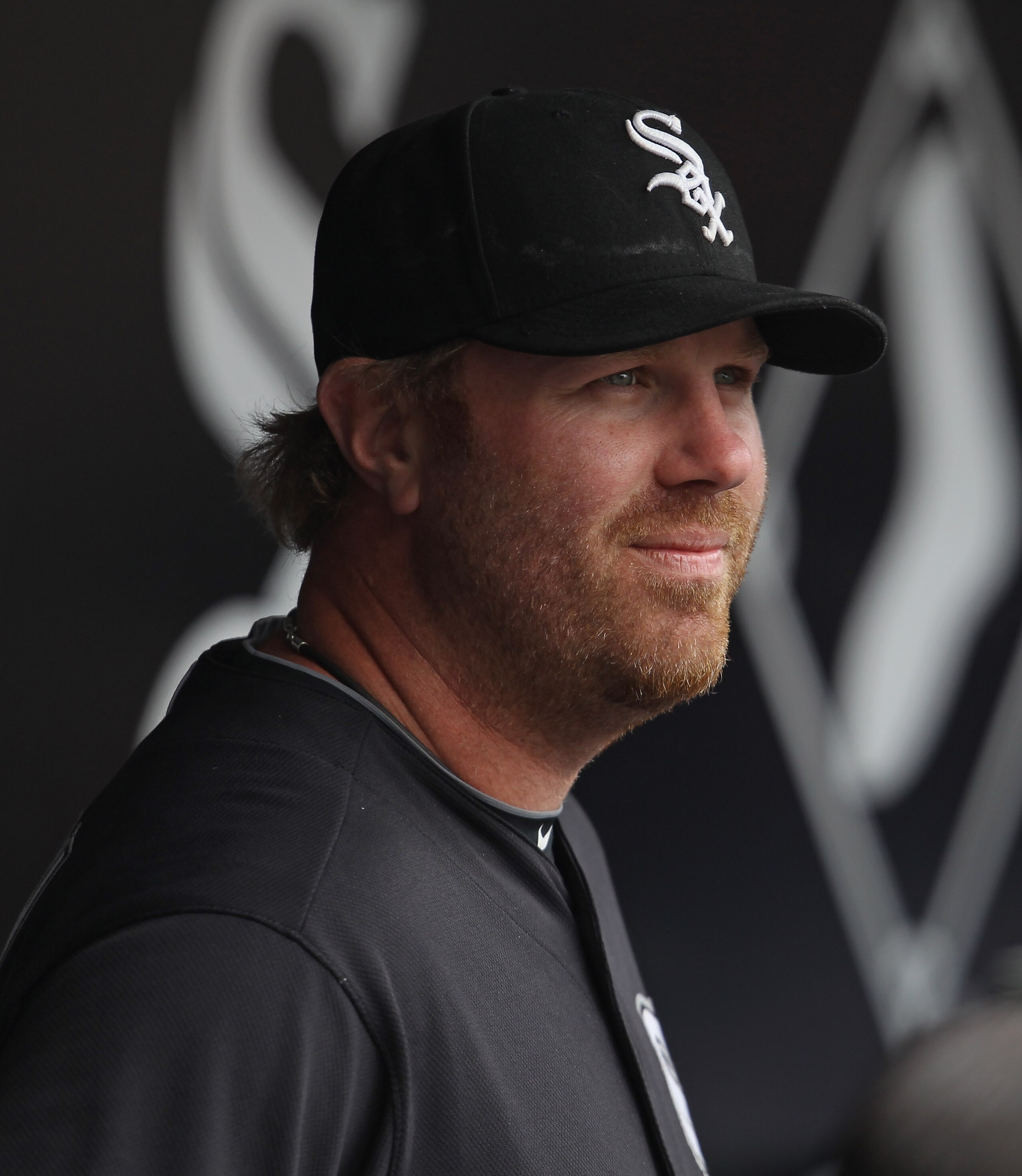 CHICAGO, IL - APRIL 07: Adam Dunn #32 of the Chicago White Sox waits in the dugout for player introductions before the home opener against the Tampa Bay Rays at U.S. Cellular Field on April 7, 2011 in Chicago, Illinois. The White Sox defeated the Rays 5-1
