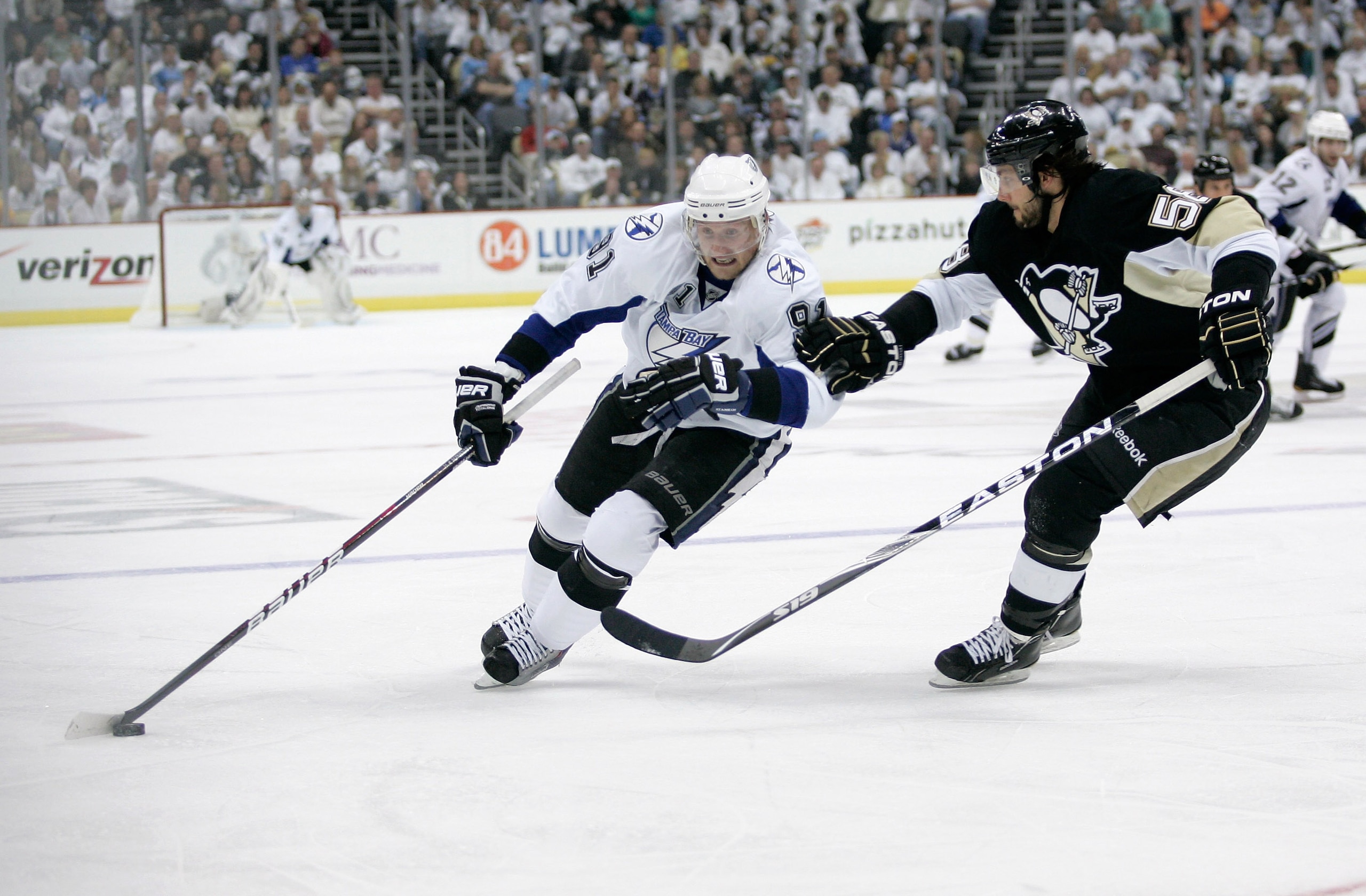 PITTSBURGH, PA - APRIL 15: Steven Stamkos#91 of the Tampa Bay Lightning controls the puck as Kris Letang #58 of the Pittsburgh Penguins defends during Game Two of the Eastern Conference Quarterfinals during the 2011 NHL Stanley Cup Playoffs at Consol Ene PITTSBURGH, PA - APRIL 15: Steven Stamkos#91 of the Tampa Bay Lightning controls the puck as Kris Letang #58 of the Pittsburgh Penguins defends during Game Two of the Eastern Conference Quarterfinals during the 2011 NHL Stanley Cup Playoffs at Consol Ene