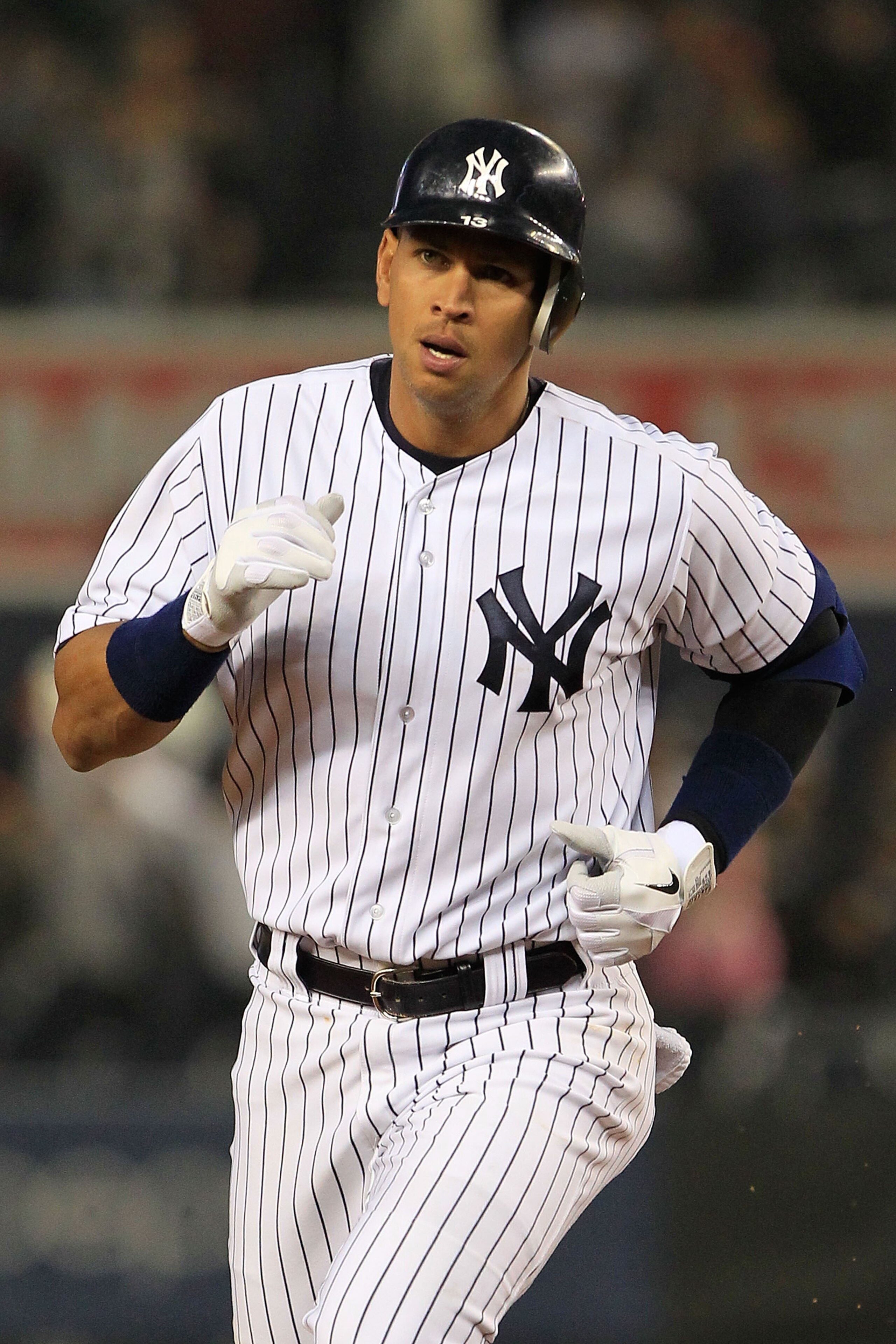 NEW YORK, NY - APRIL 13:  Alex Rodriguez #13 of the New York Yankees runs the bases after he hits a 3 run homerun in the first inning against the Baltimore Orioles at Yankee Stadium on April 13, 2011 in the Bronx borough of New York City.  (Photo by Chris