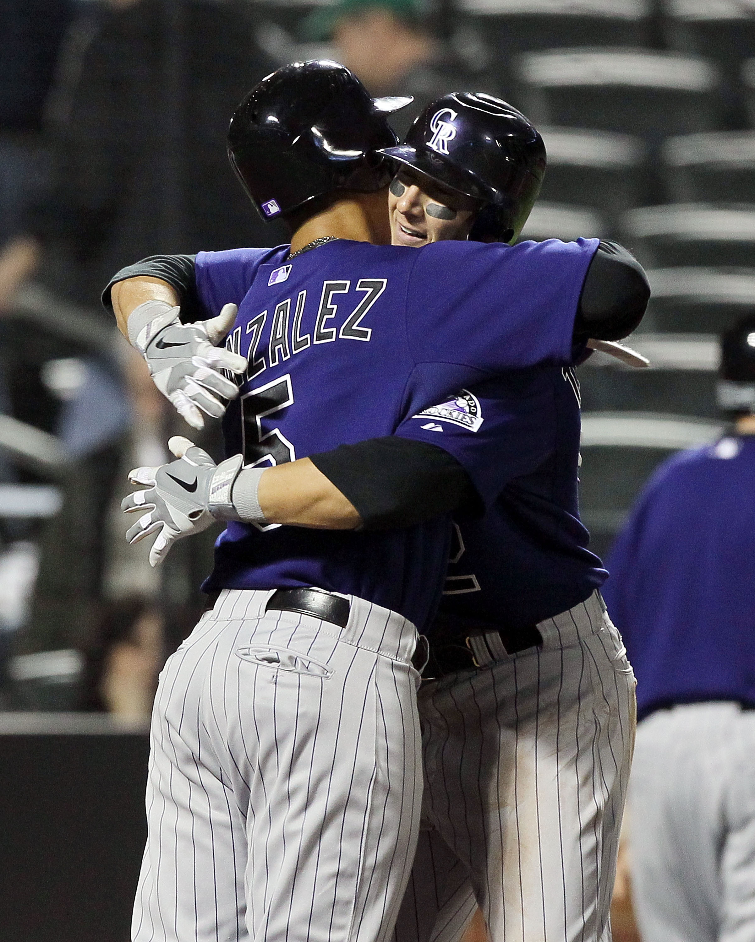 NEW YORK, NY - APRIL 11:  Troy Tulowitzki #2 of the Colorado Rockies celebrates his seventh inning two-run home run against of the New York Mets with teammate Carlos Gonzalez #5 on April 11, 2011 at Citi Field in the Flushing neighborhood of the Queens bo