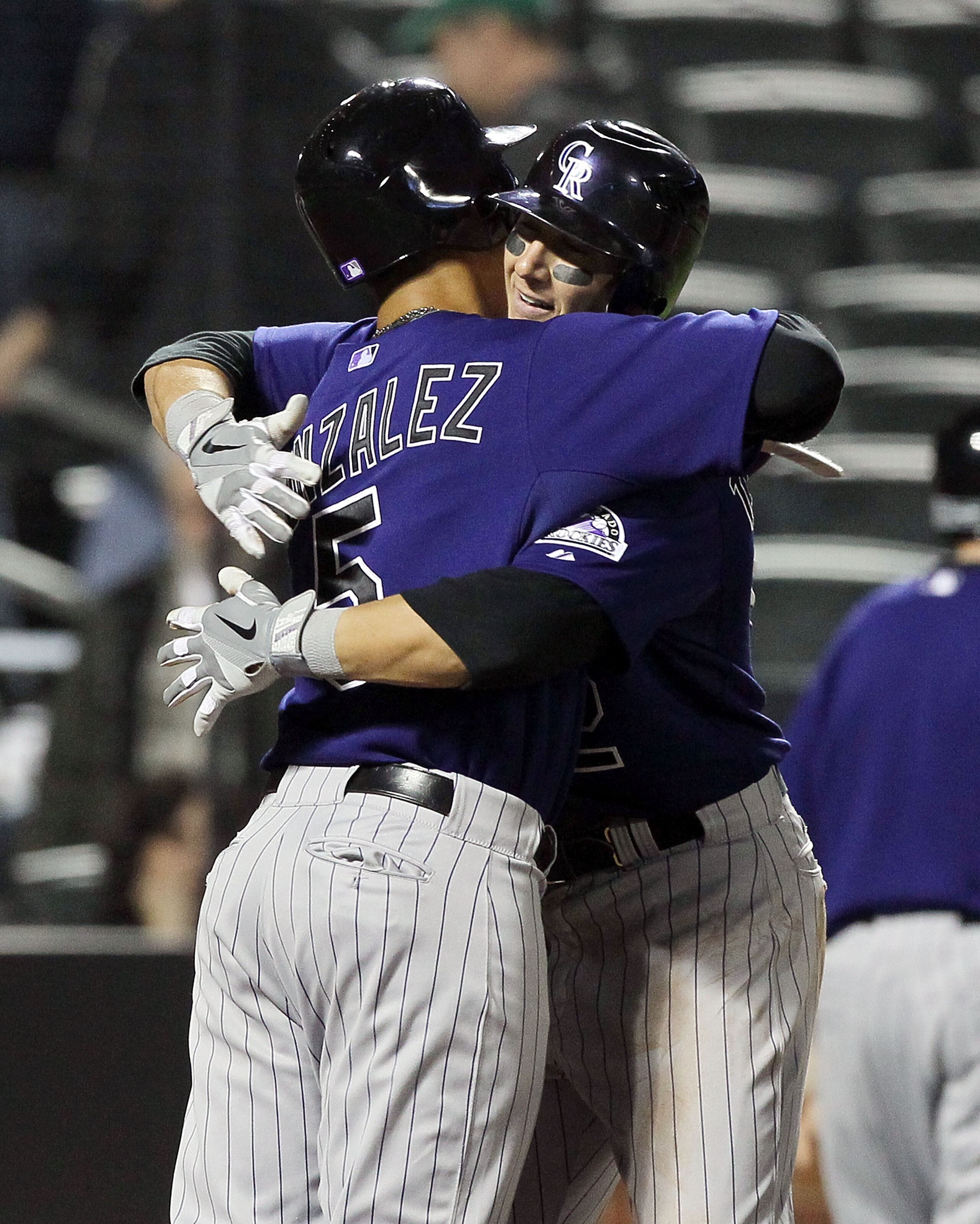 NEW YORK, NY - APRIL 11:  Troy Tulowitzki #2 of the Colorado Rockies celebrates his seventh inning two-run home run against of the New York Mets with teammate Carlos Gonzalez #5 on April 11, 2011 at Citi Field in the Flushing neighborhood of the Queens bo