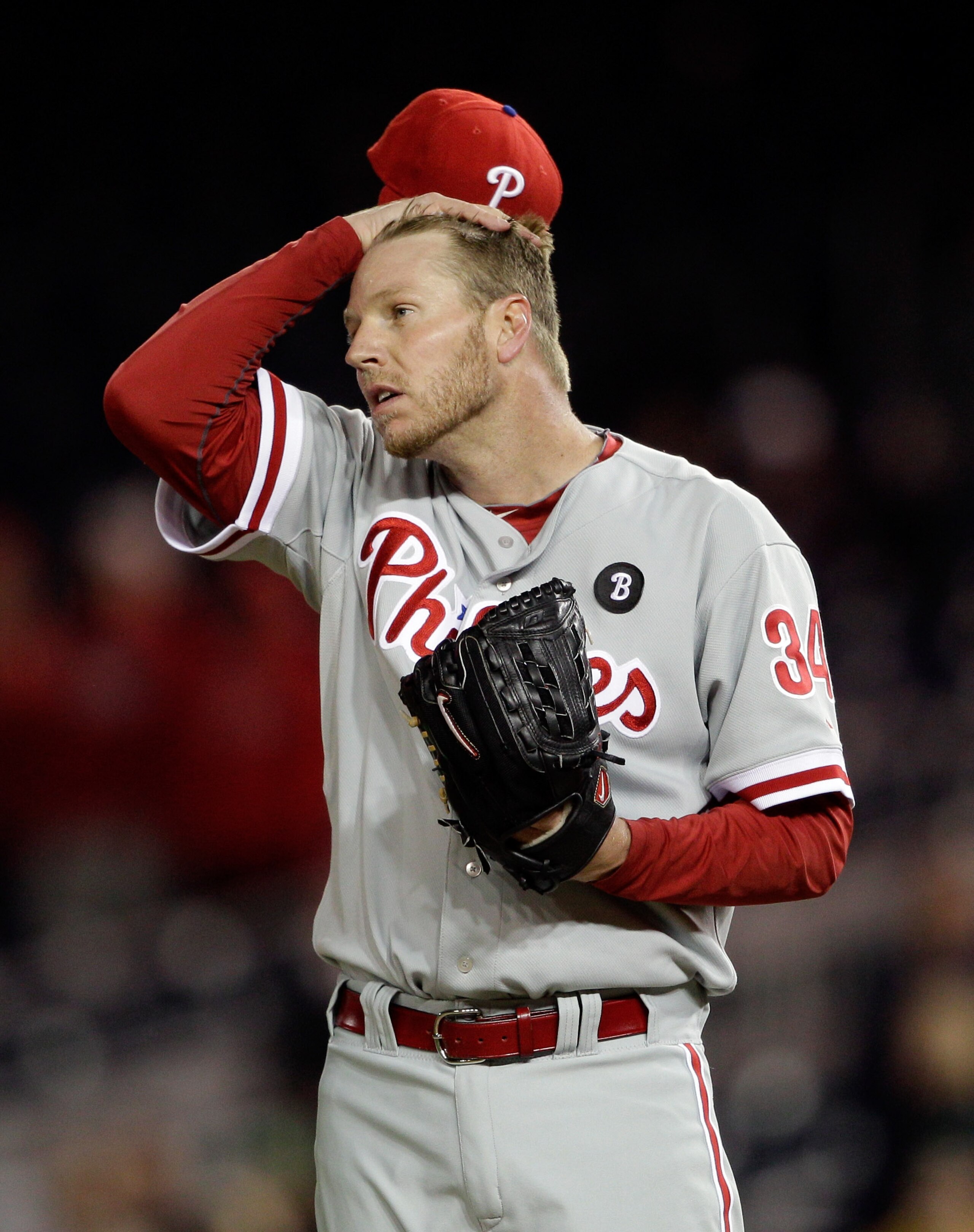 WASHINGTON, DC - APRIL 13: Roy Halladay #34 of the Philadelphia Phillies adjust his cap after giving up a run to the Washington Nationals during the ninth inning at Nationals Park on April 13, 2011 in Washington, DC.  (Photo by Rob Carr/Getty Images)