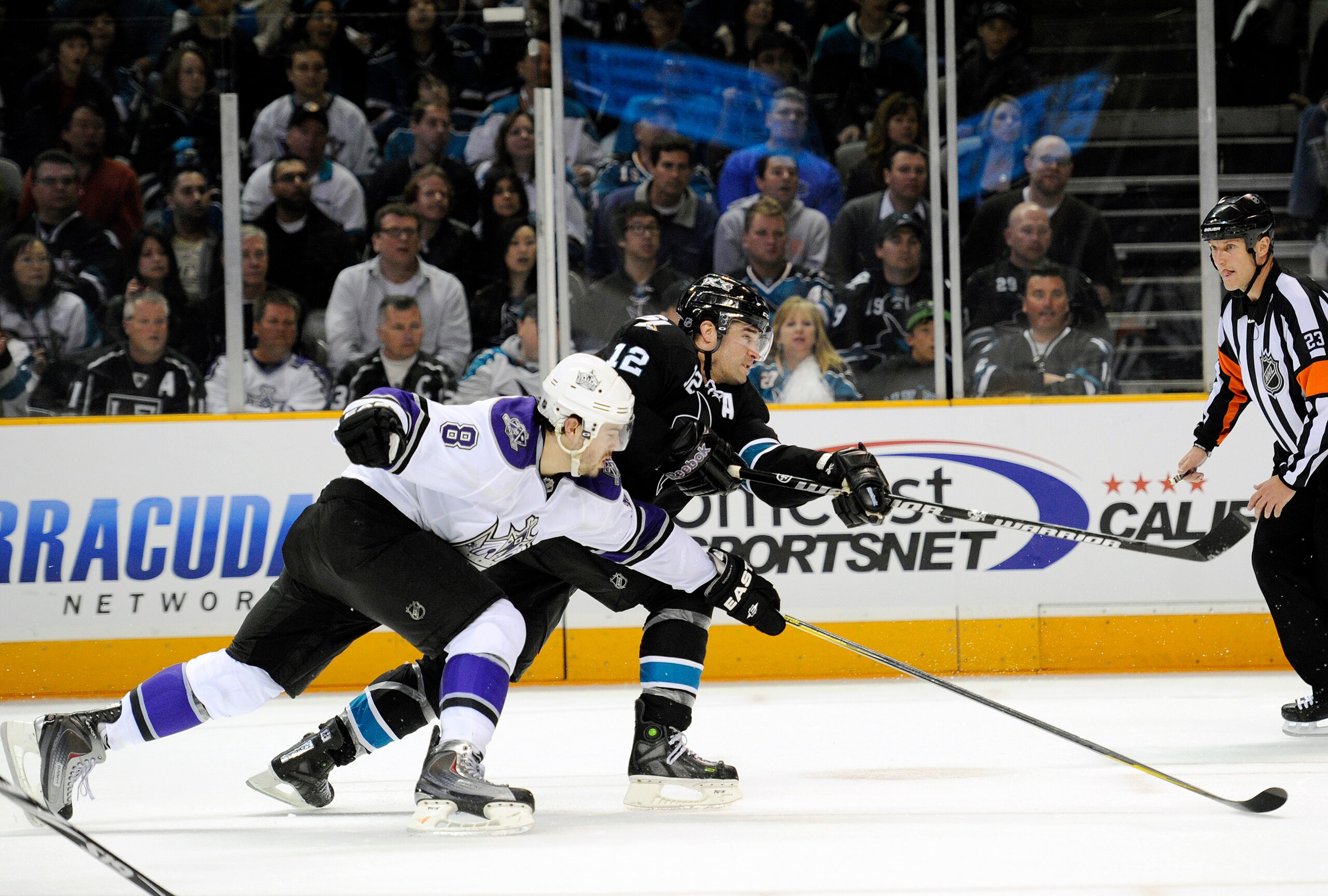 SAN JOSE, CA - APRIL 14: Patrick Marleau #12 of the San Jose Sharks, in overtime shoots on goal pass Drew Doughty #8 of the Los Angeles Kings in Game One of the Western Conference Quarterfinals during the 2011 NHL Stanley Cup Playoffs at the HP Pavilion SAN JOSE, CA - APRIL 14: Patrick Marleau #12 of the San Jose Sharks, in overtime shoots on goal pass Drew Doughty #8 of the Los Angeles Kings in Game One of the Western Conference Quarterfinals during the 2011 NHL Stanley Cup Playoffs at the HP Pavilion