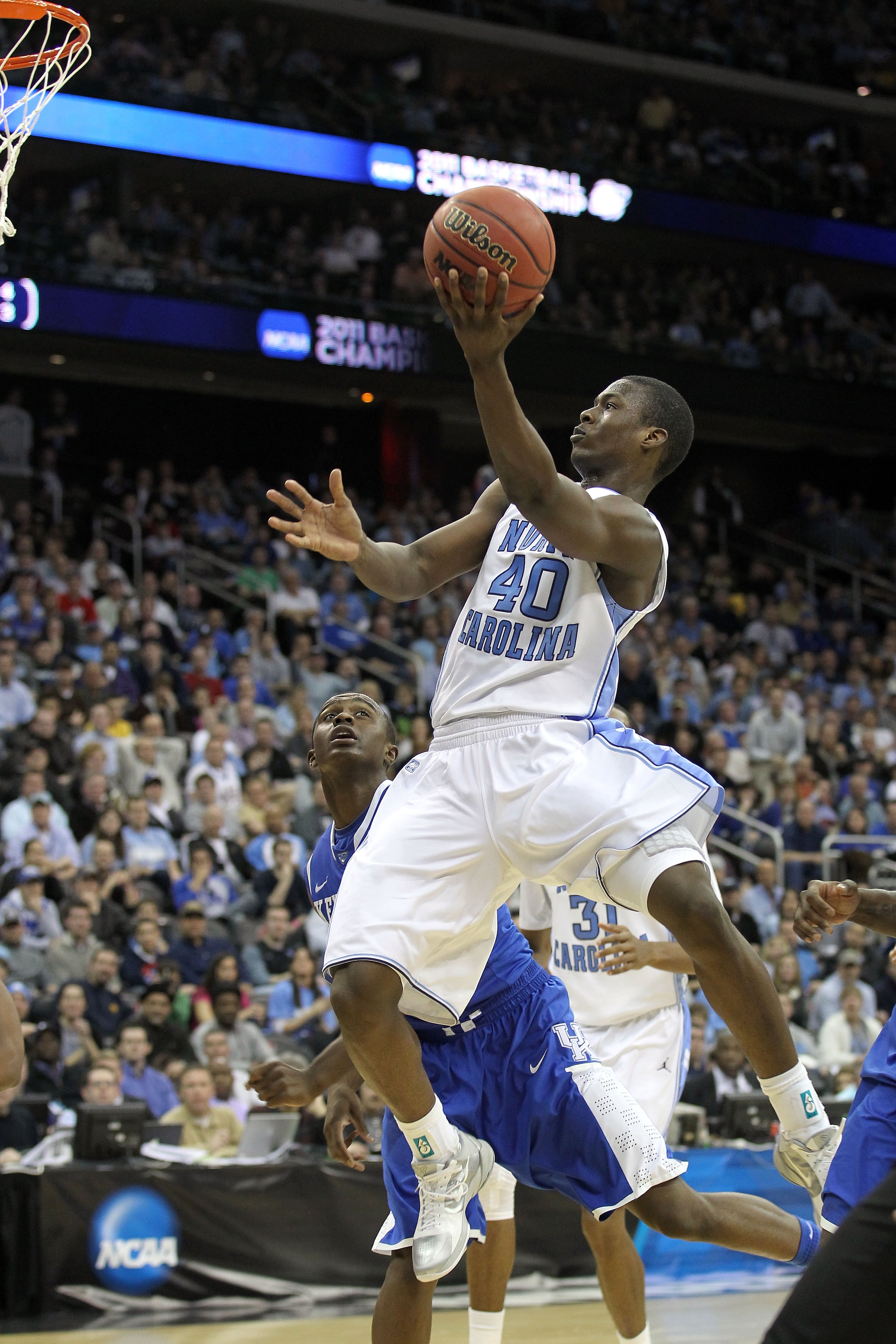 NEWARK, NJ - MARCH 27:  Harrison Barnes #40 of the North Carolina Tar Heels goes for a layup against Doron Lamb #20 of the Kentucky Wildcats during the east regional final of the 2011 NCAA men's basketball tournament at Prudential Center on March 27, 2011