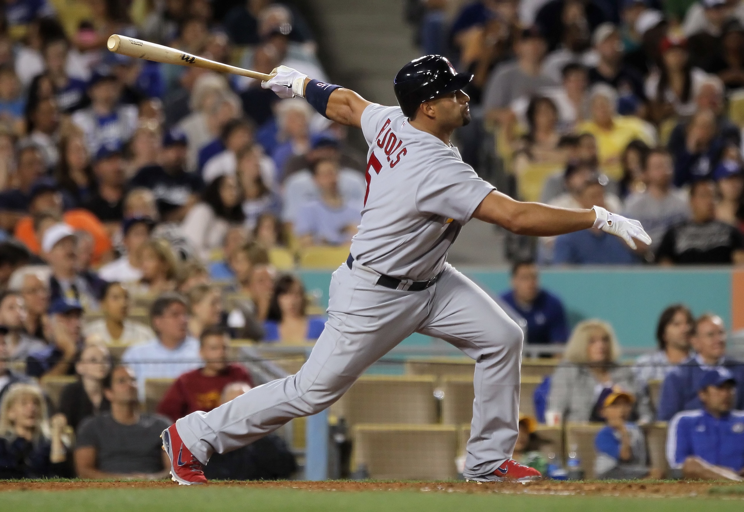 LOS ANGELES, CA - APRIL 16:  Albert Pujols #5 of the St Louis Cardinals hits a base hit in the fifth inning against the Los Angeles Dodgers at Dodger Stadium on April 16, 2011 in Los Angeles, California. The Cardinals defeated the Dodgers 9-2.  (Photo by