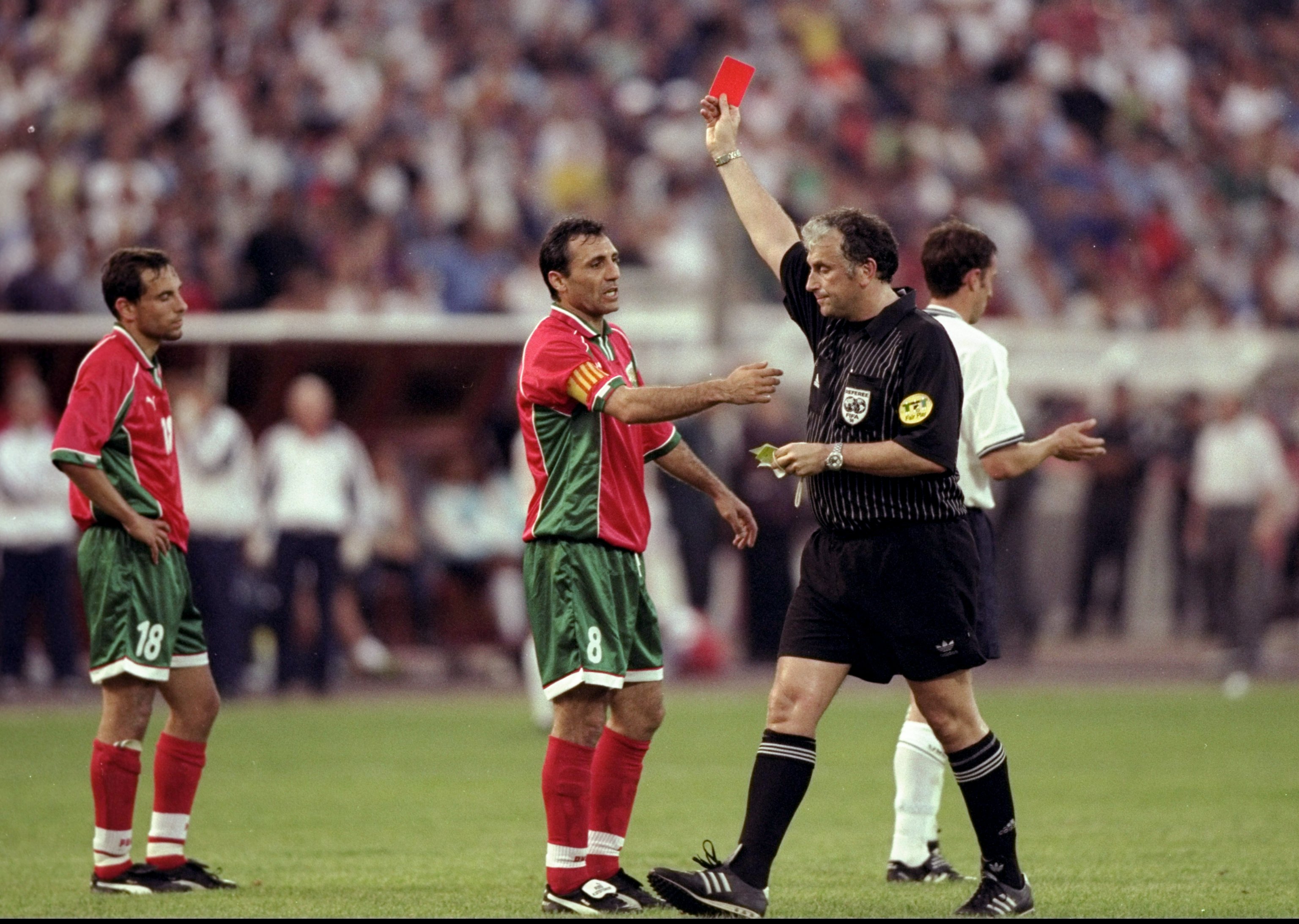 9 Jun 1999:  Referee Mario van der Ende sends off Martin Petrov (no. 18) of Bulgaria despite the protests of team mate Hristo Stoichkov in the European Championship qualifier against England at the Bulgarska Armia Stadium in Sofia, Bulgaria. The game ende