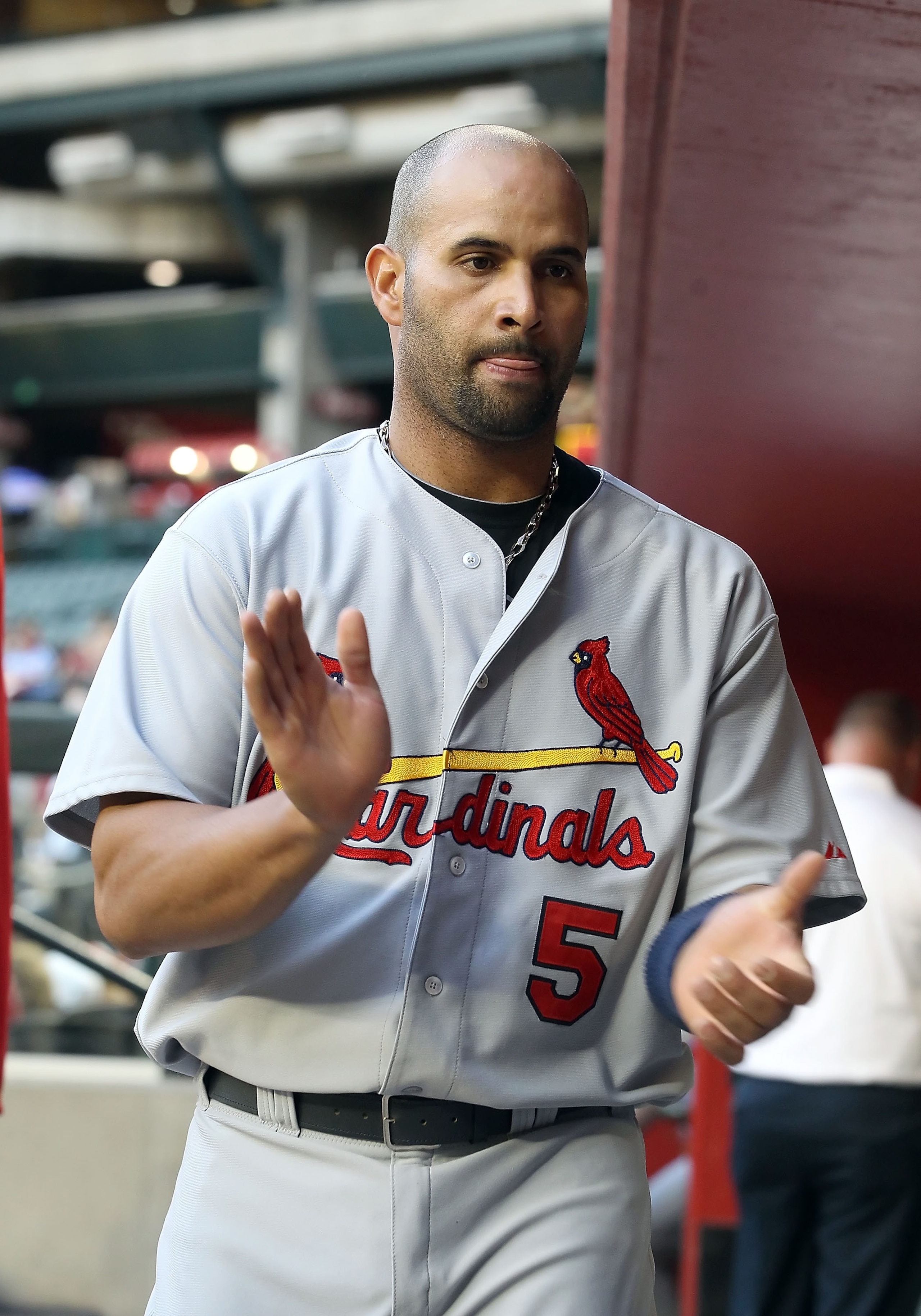 PHOENIX, AZ - APRIL 12:  Albert Pujols #5 of the St. Louis Cardinals in the dugout during the Major League Baseball game against the Arizona Diamondbacks at Chase Field on April 12, 2011 in Phoenix, Arizona. The Diamondbacks defeated the Cardinals 13-8.