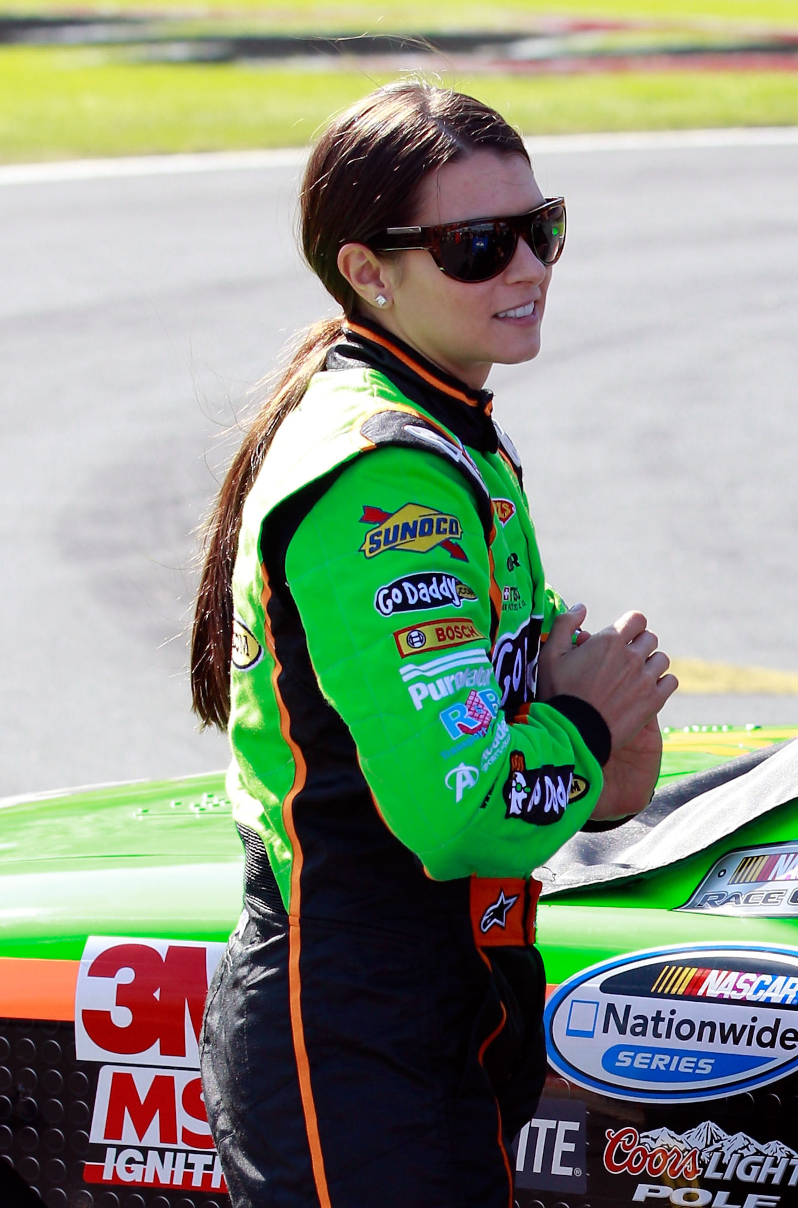 CONCORD, NC - OCTOBER 15: Danica Patrick, driver of the #7 GoDaddy.com Chevrolet, stands on pit road during qualifying for the NASCAR Nationwide Series Dollar General 300 at Charlotte Motor Speedway on October 15, 2010 in Concord, North Carolina. (Photo CONCORD, NC - OCTOBER 15: Danica Patrick, driver of the #7 GoDaddy.com Chevrolet, stands on pit road during qualifying for the NASCAR Nationwide Series Dollar General 300 at Charlotte Motor Speedway on October 15, 2010 in Concord, North Carolina. (Photo