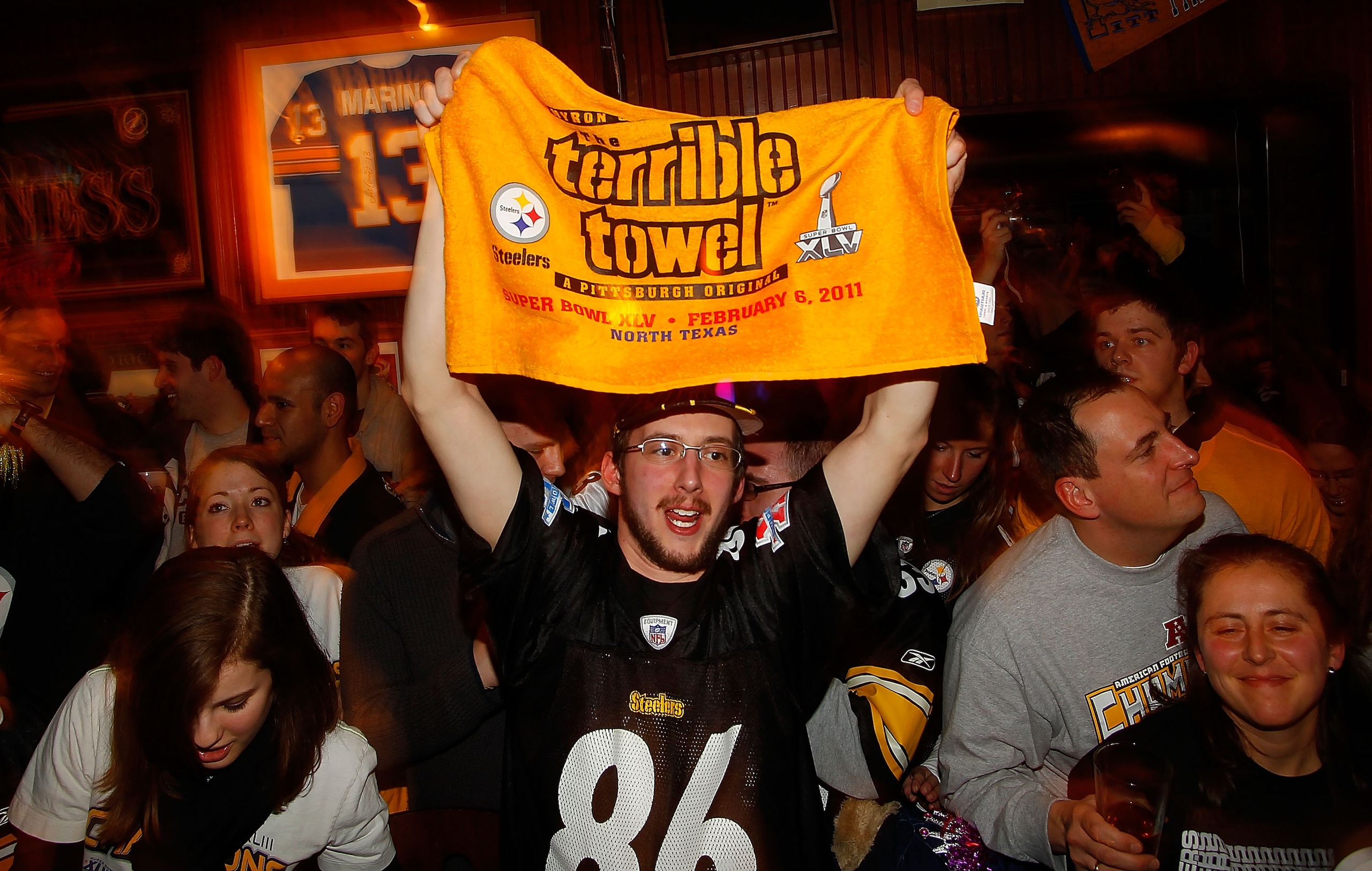 PITTSBURGH - FEBRUARY 06:  Pittsburgh Steelers fans watch Super Bowl XLV on February 6, 2011 at Peter's Pub in the Oakland neighborhood of Pittsburgh, Pennsylvania.  (Photo by Jared Wickerham/Getty Images)
