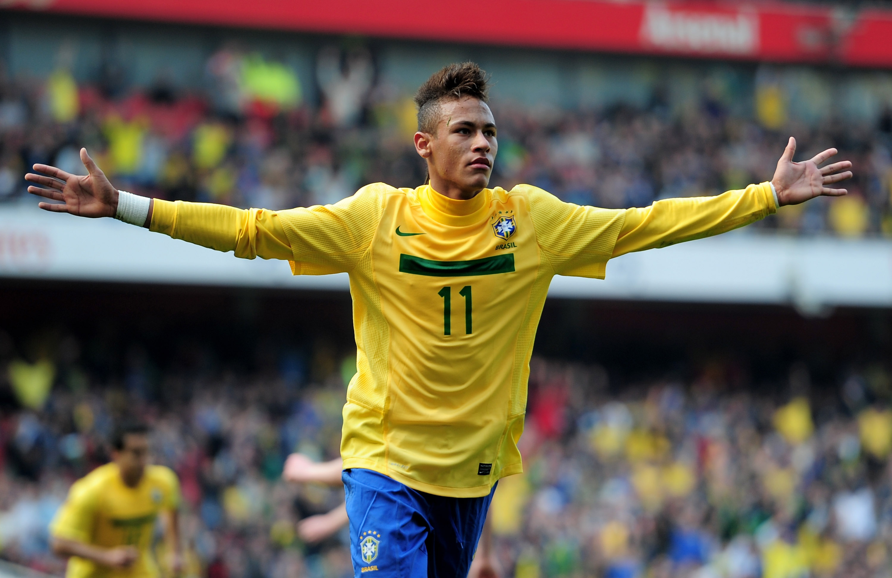 LONDON, ENGLAND - MARCH 27: Neymar of Brazil celebrates scoring the opening goal during the International friendly match between Brazil and Scotland at Emirates Stadium on March 27, 2011 in London, England.  (Photo by Jamie McDonald/Getty Images)