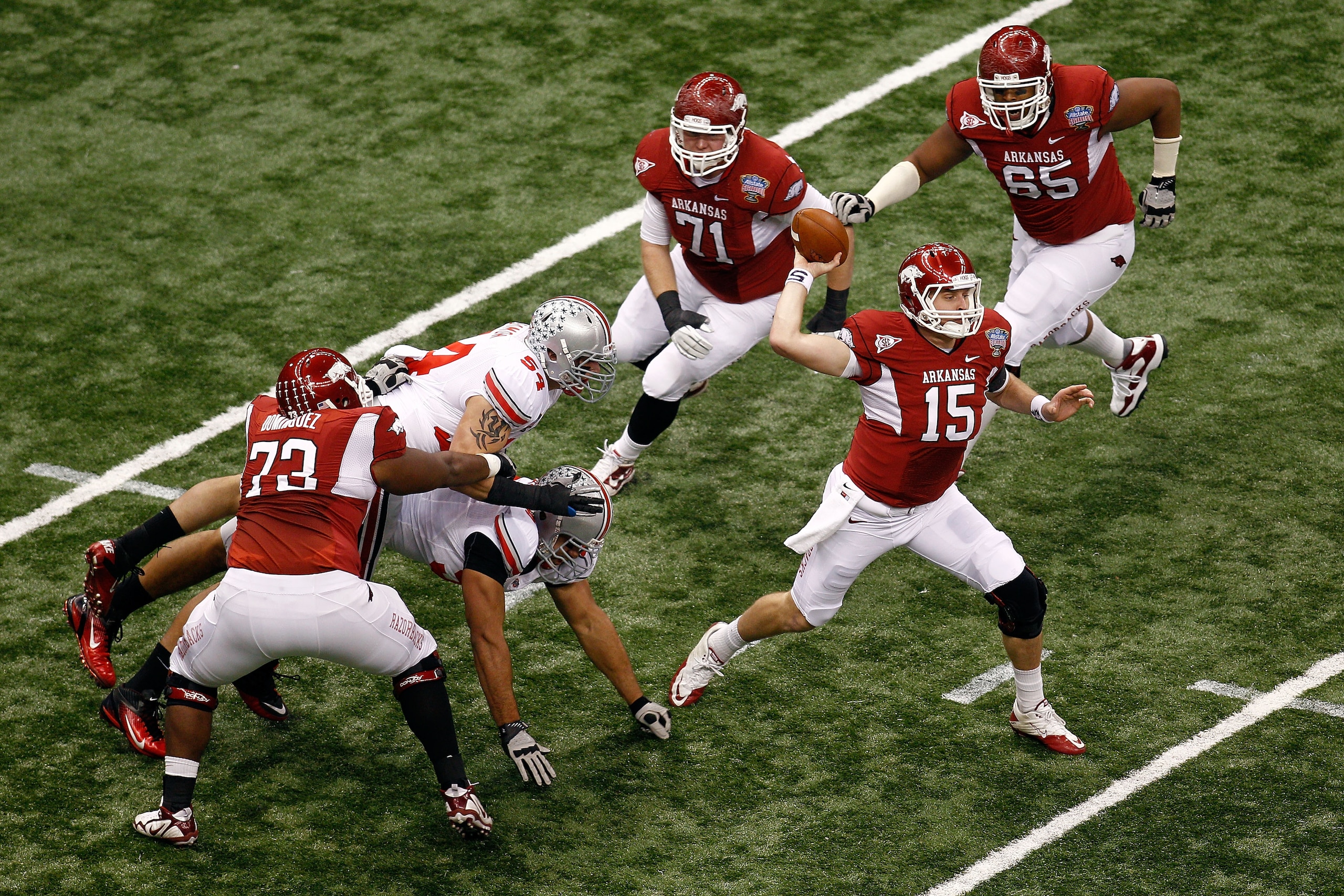 NEW ORLEANS, LA - JANUARY 04:  Quarterback Ryan Mallett #15 of the Arkansas Razorbacks throws the ball in the first quarter against the Ohio State Buckeyes during the Allstate Sugar Bowl at the Louisiana Superdome on January 4, 2011 in New Orleans, Louisi